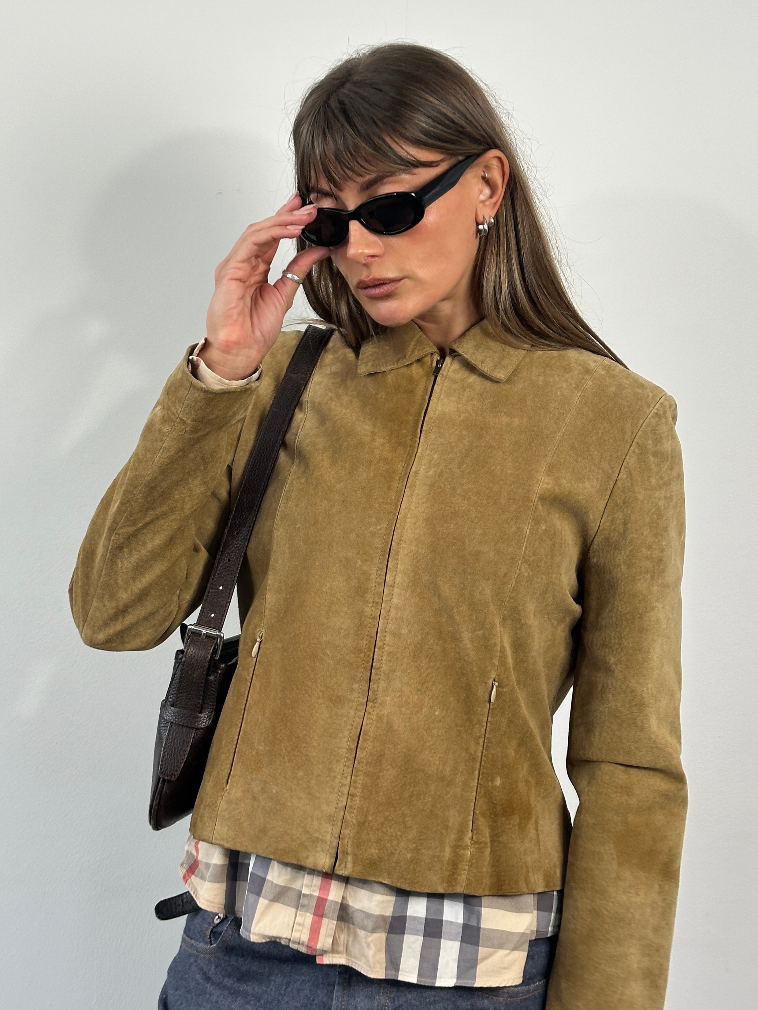 Vintage 1990s suede leather jacket, size small, featuring classic design and soft brown suede material.