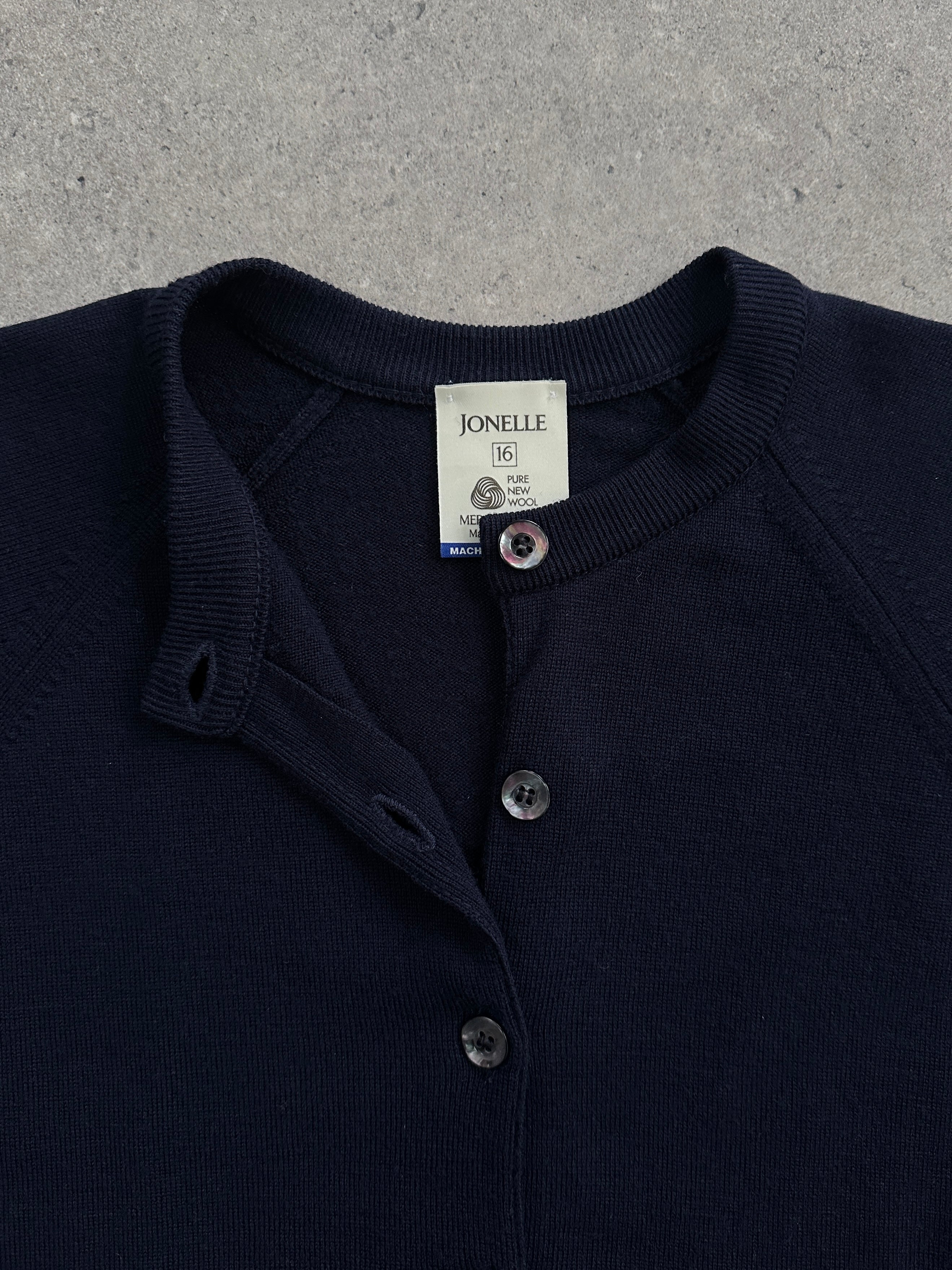 Vintage 1990s Scottish Merino wool round collar cardigan in size M, featuring classic knit detailing and a cozy, timeless design.