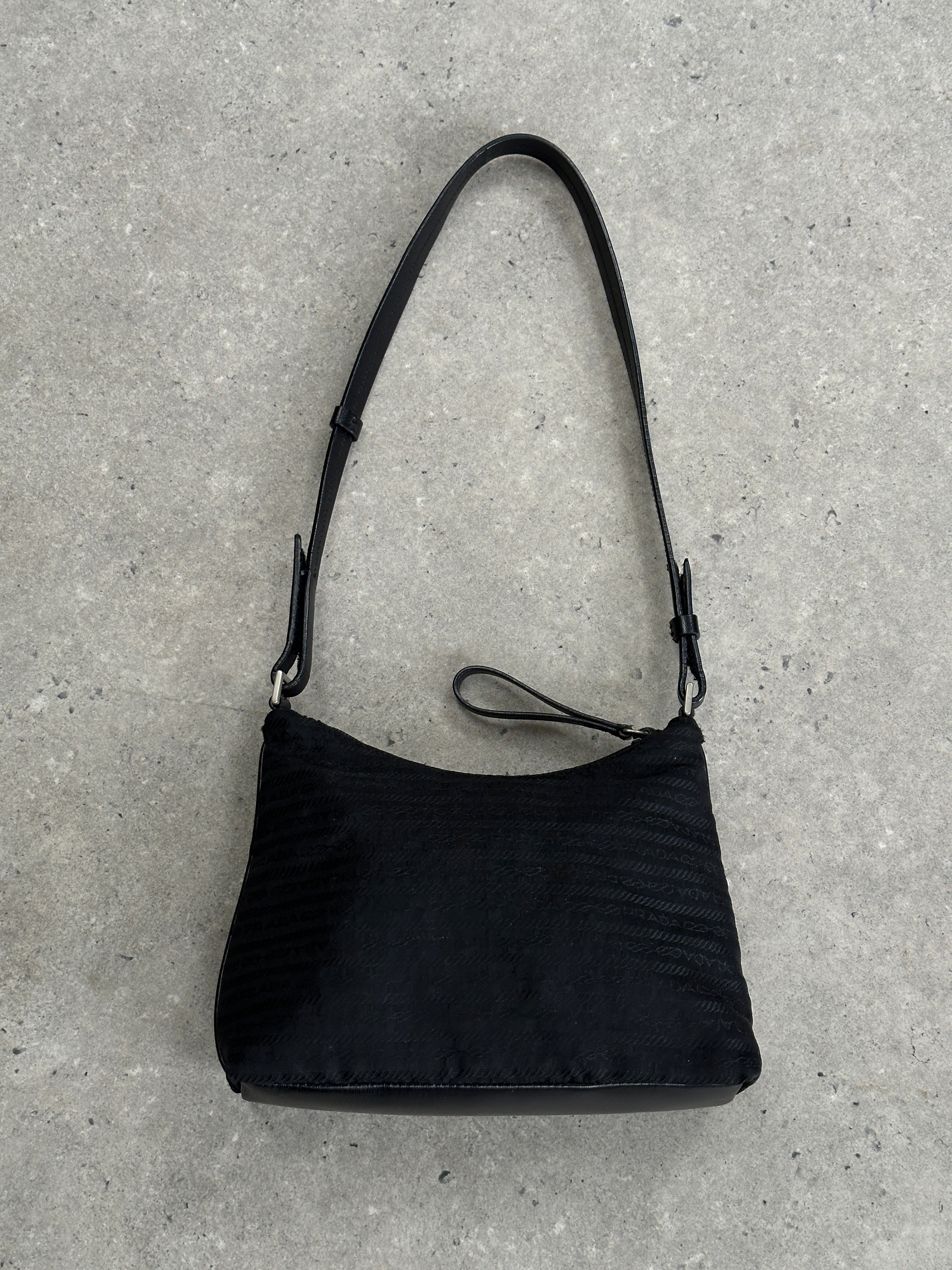 Prada nylon Tessuto Monogram crossbody bag with adjustable strap and signature logo, featuring a sleek and functional design.