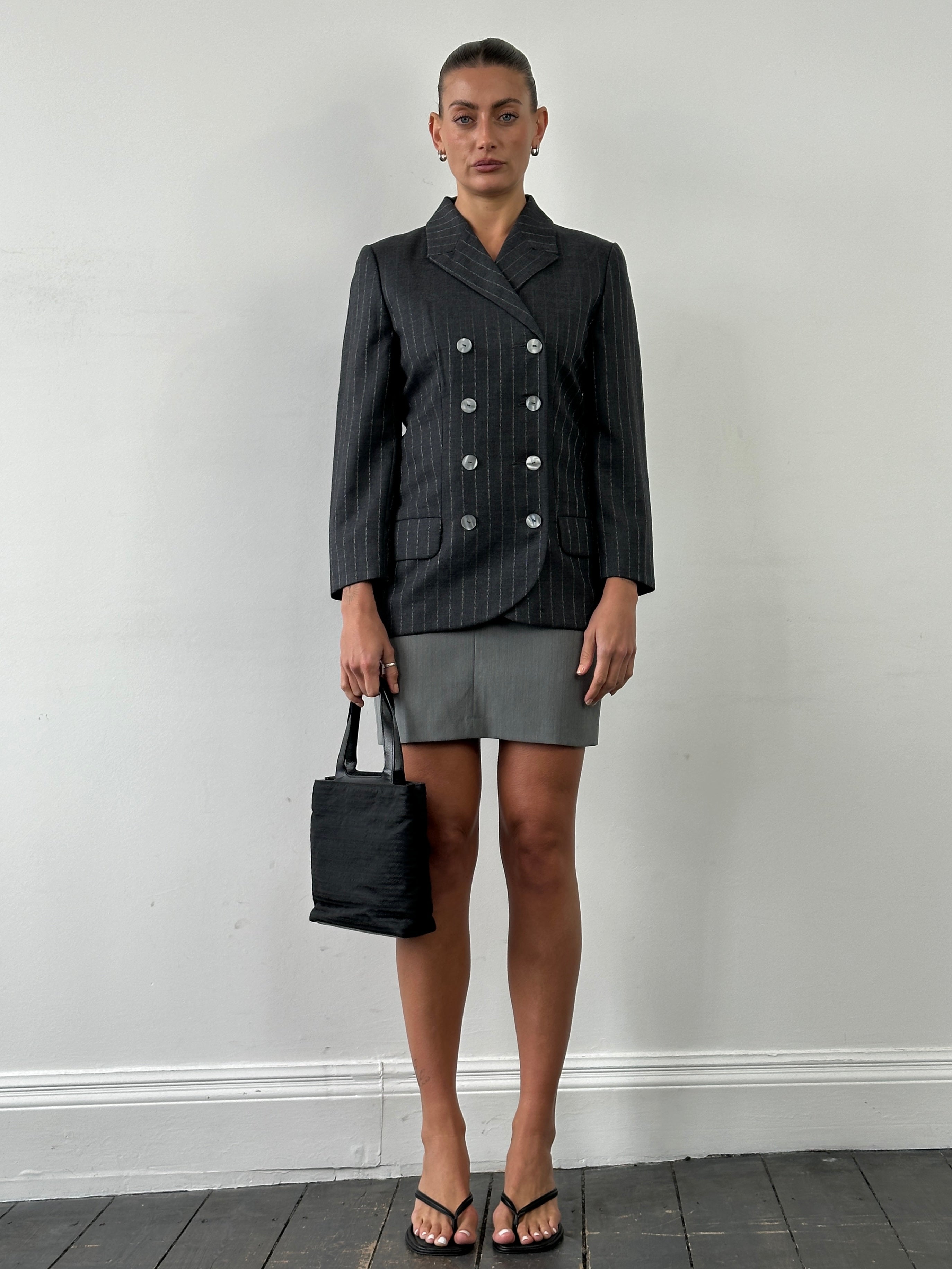 Vintage Italian double layered front split mini skirt, stylish and trendy, showing the layered fabric and split design.