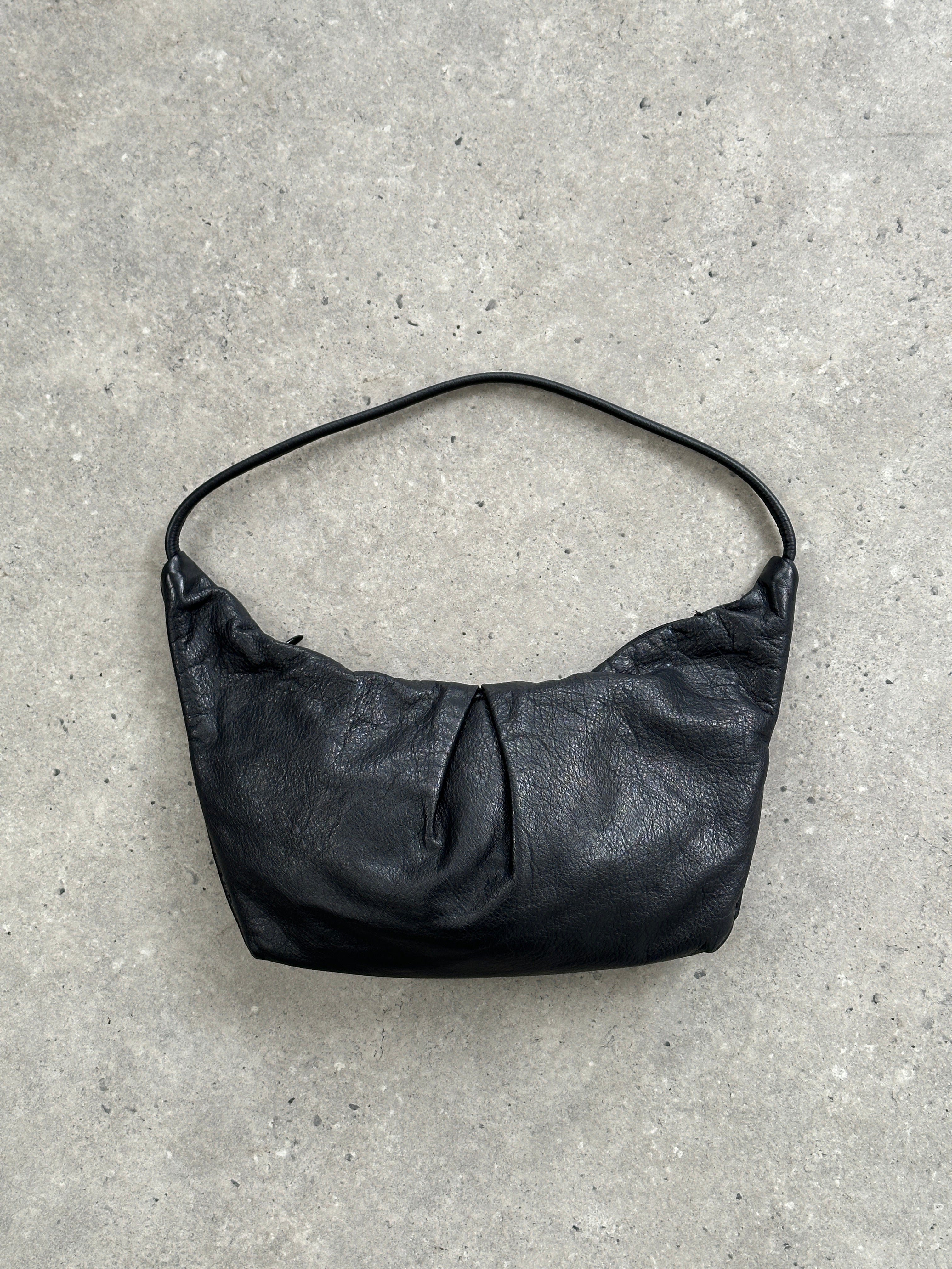 Max & Co leather crescent shoulder bag with adjustable strap and sleek design, featuring a smooth leather finish.