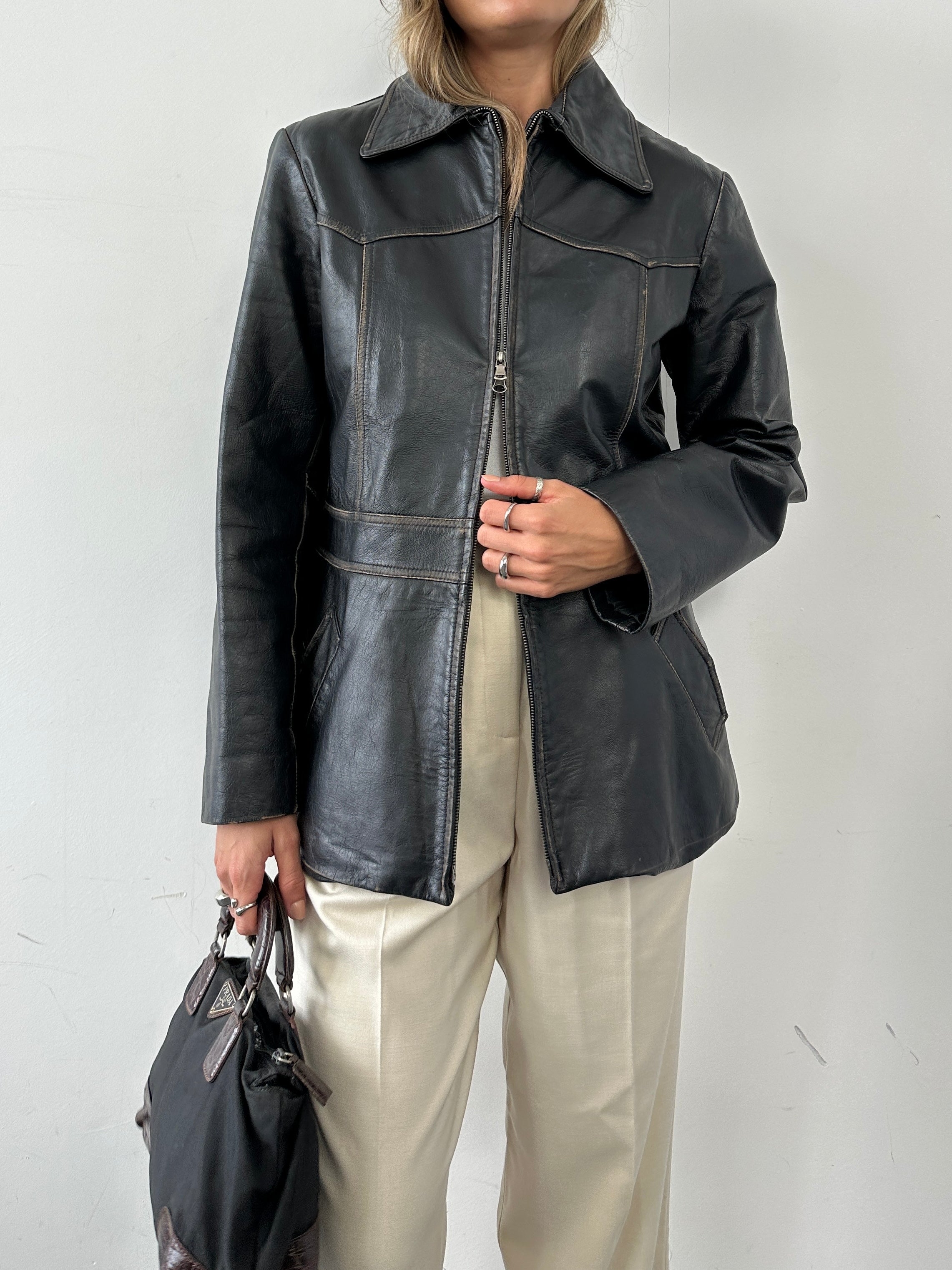 Conbipel double zip waisted leather jacket in black, featuring a fitted design and two front zippers for a stylish look.
