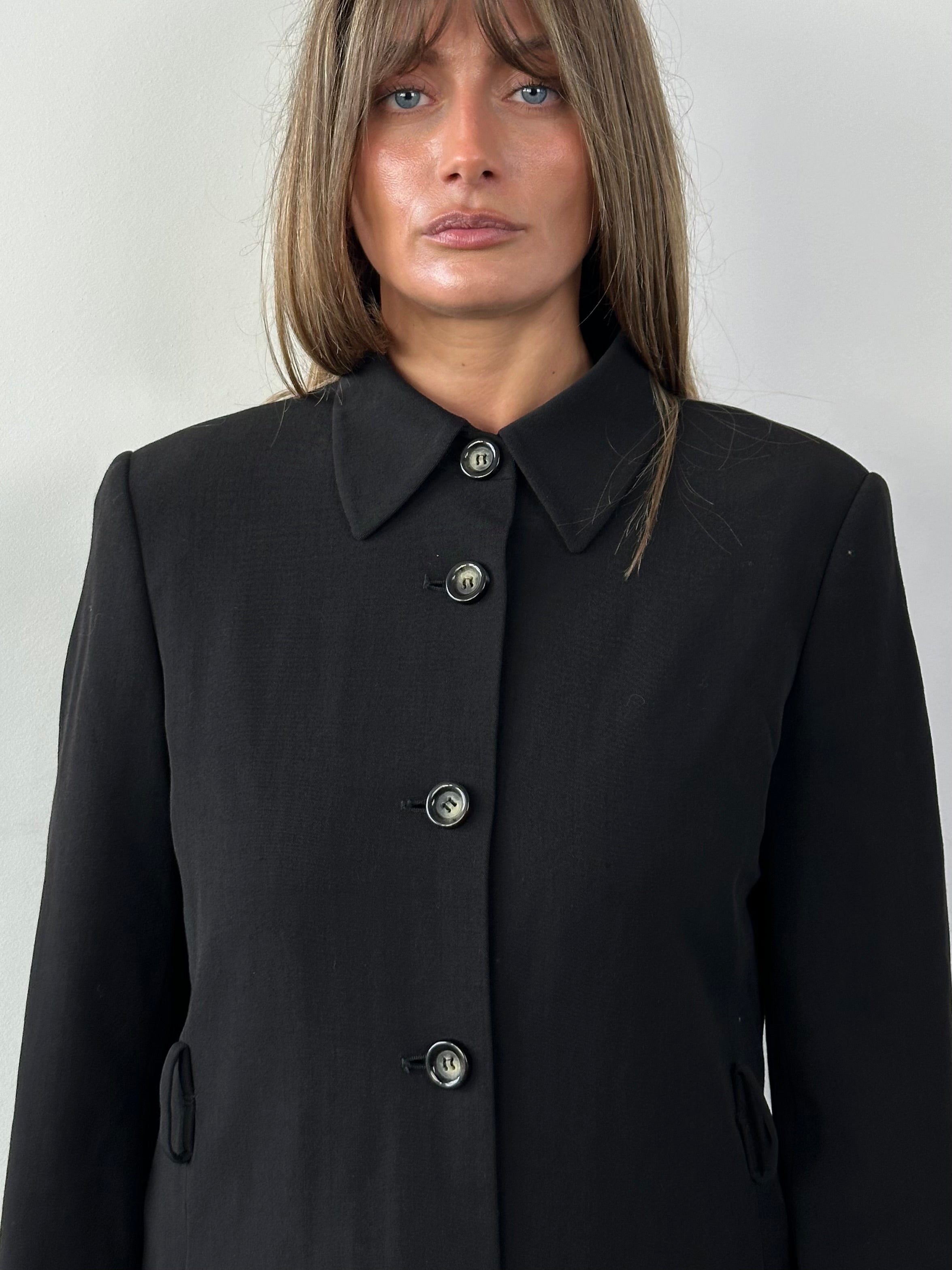Iceberg 1990s virgin wool tailored jacket in size M, featuring classic design and structured fit, shown on a hanger.