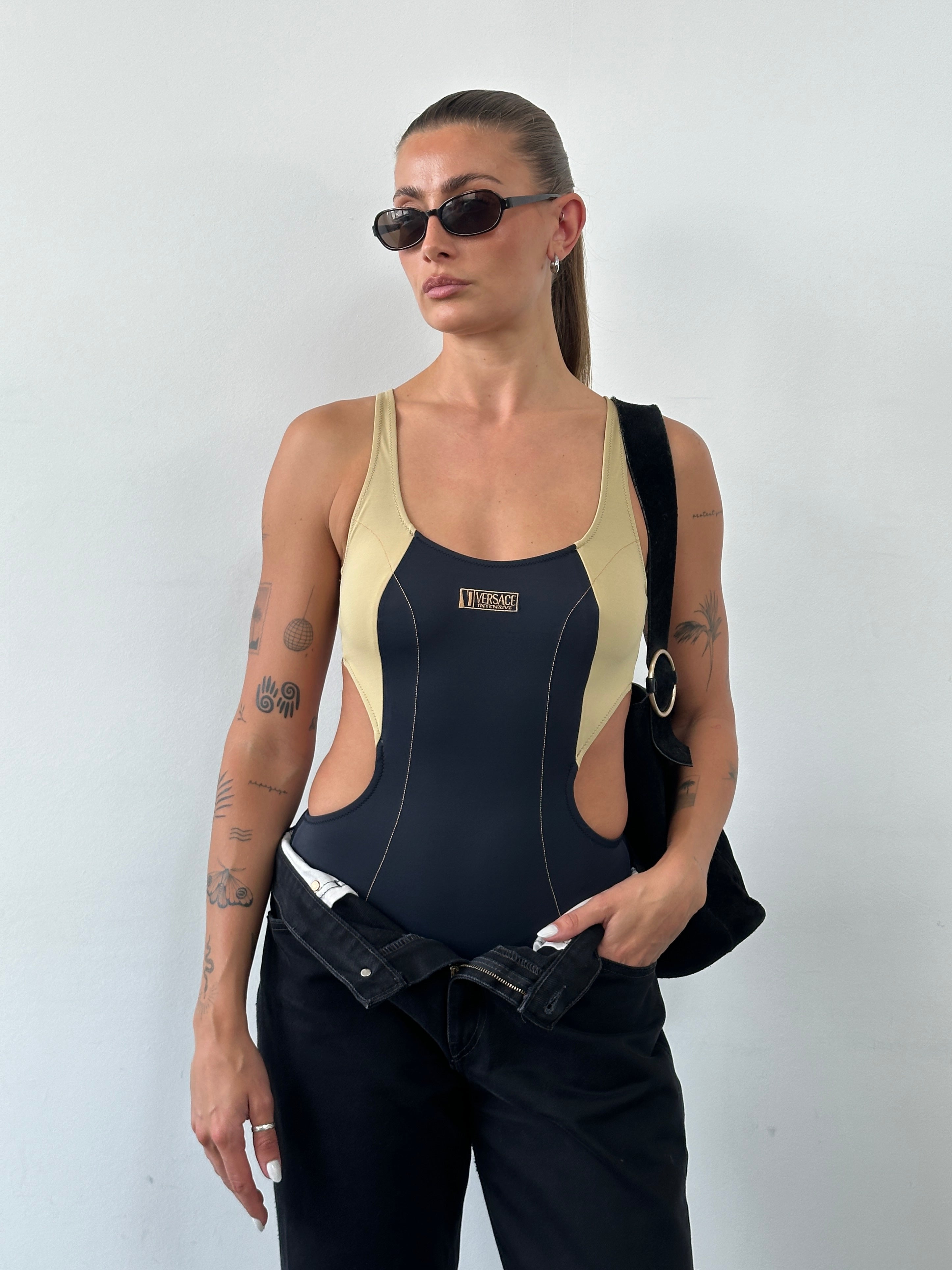 Versace Intensive 1990s high cut logo one-piece swimsuit top in black with iconic branding and sleek design.