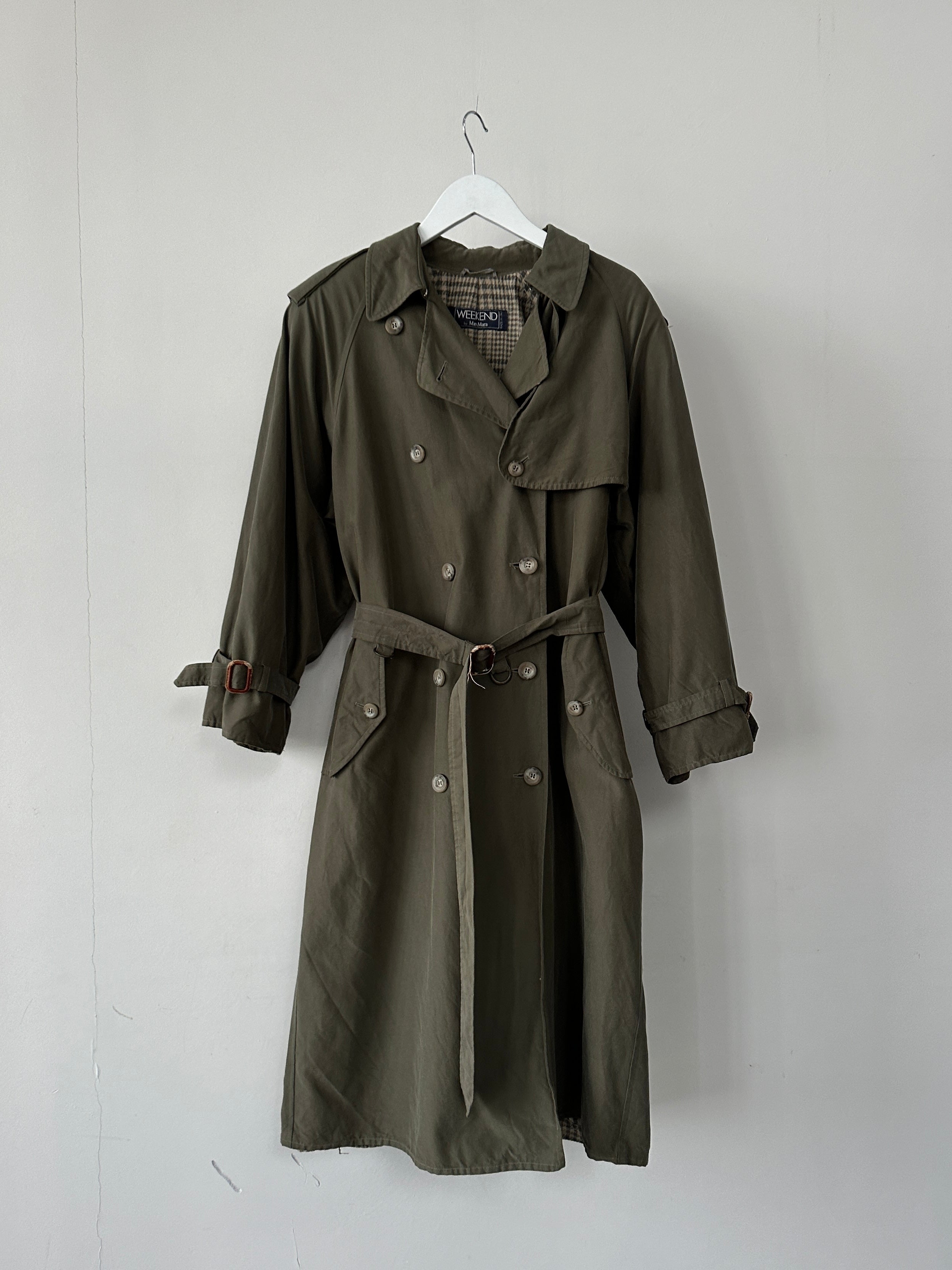 Max Mara Weekend double-breasted belted trench coat in beige, shown from the front with classic lapels and waist belt.