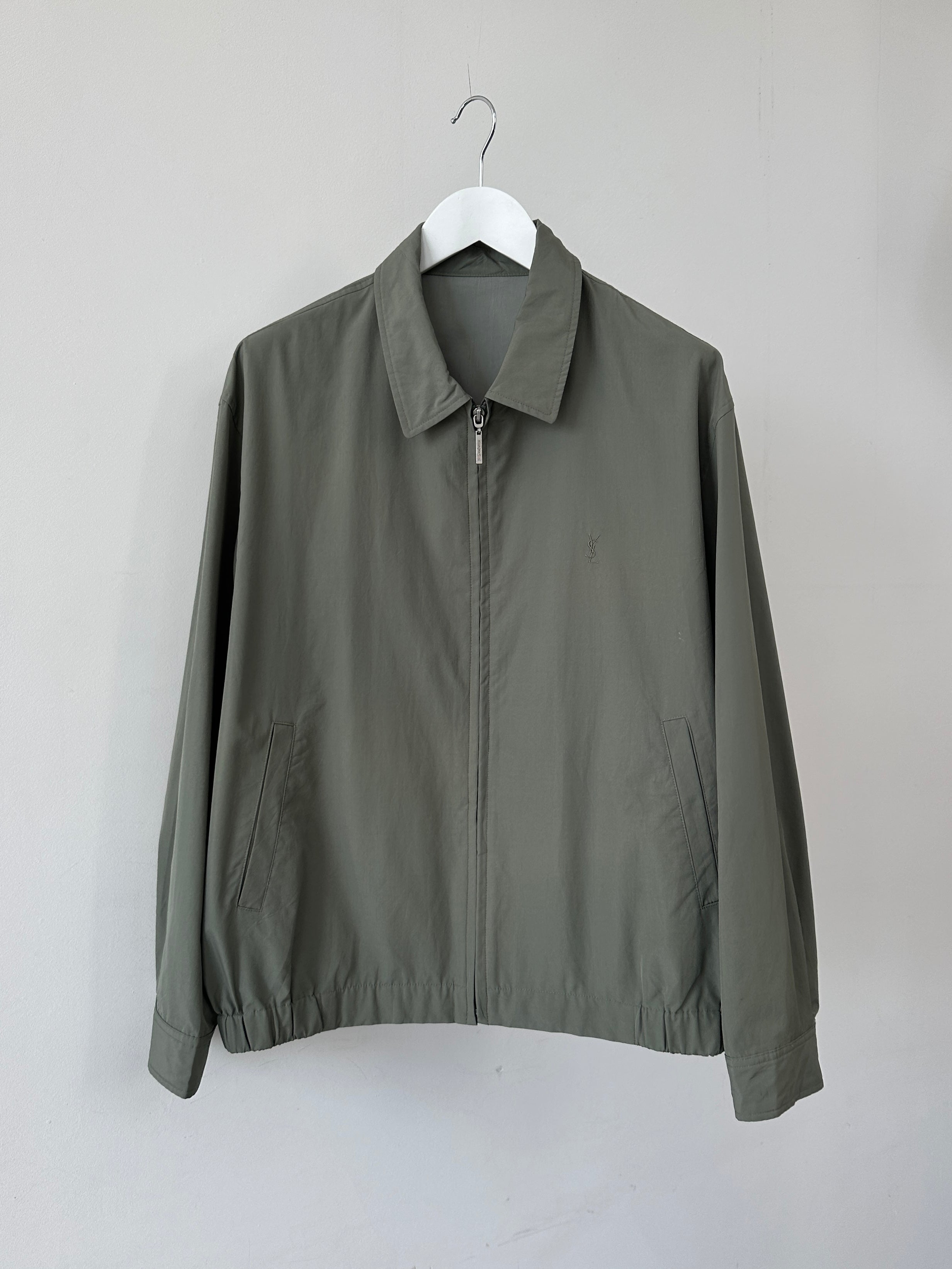 Yves Saint Laurent Pour Homme logo bomber jacket in size L, black with front logo patch and ribbed cuffs, casual men's outerwear
