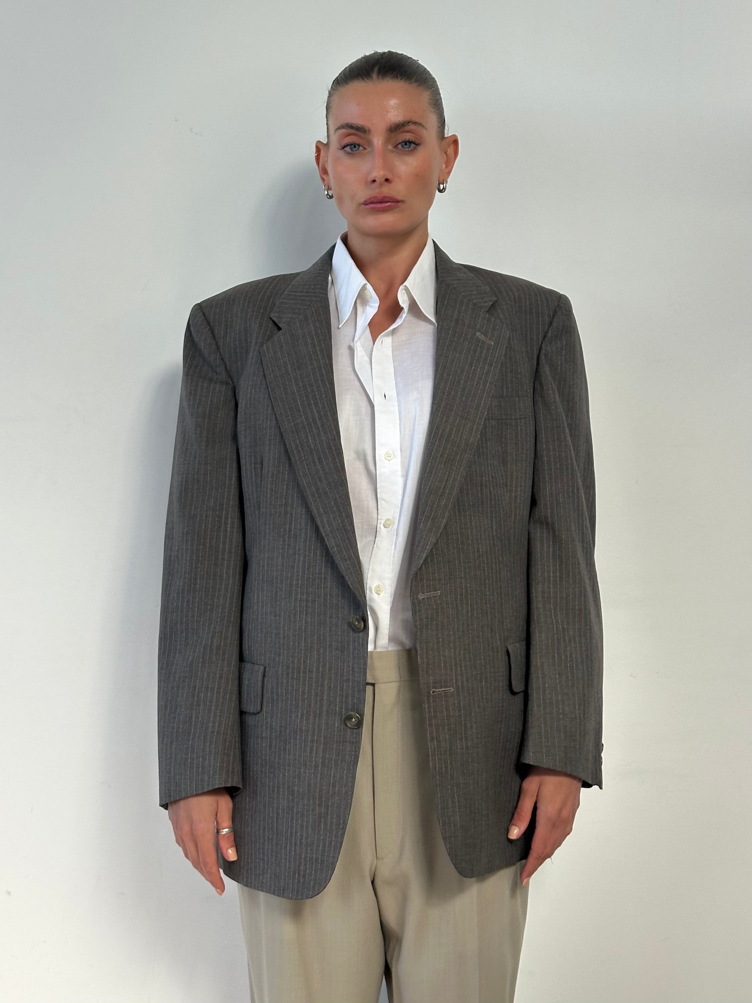 Christian Dior Monsieur 1990s striped wool blazer in size 40R/M, tailored with classic design and bold stripe pattern.