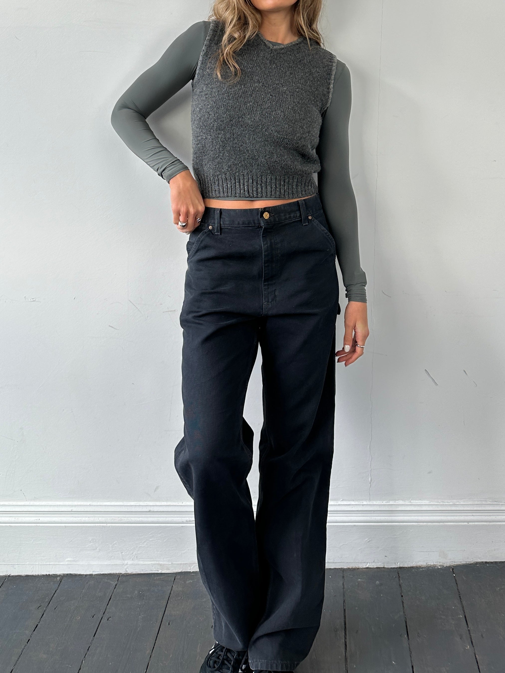 Vintage Pure Shetland Wool sleeveless vest jumper in size small, featuring a classic, textured design and natural wool material.