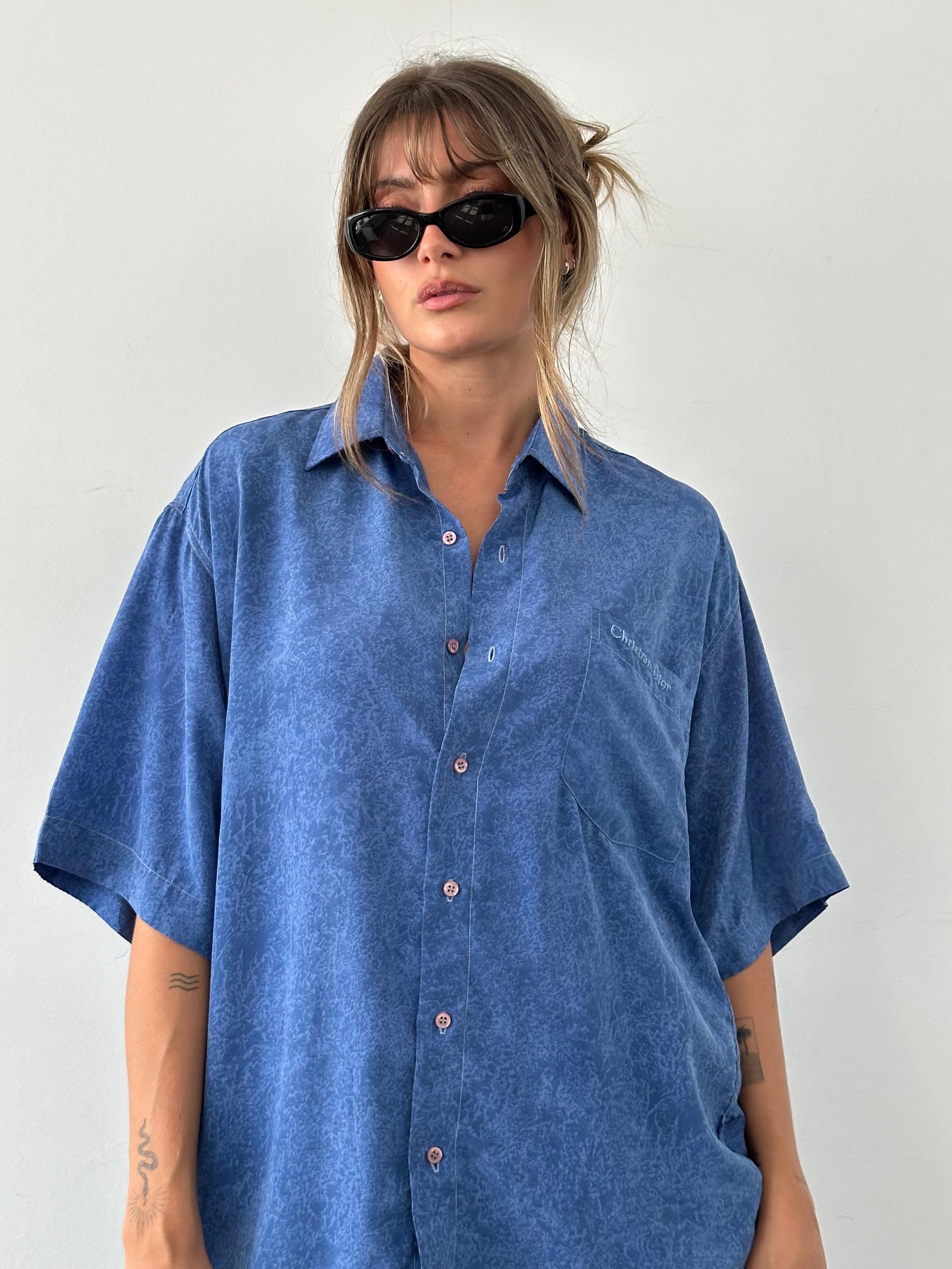 Christian Dior 90s silk print short sleeve shirt in size XL with bold logo and vibrant pattern, classic luxury fashion piece.