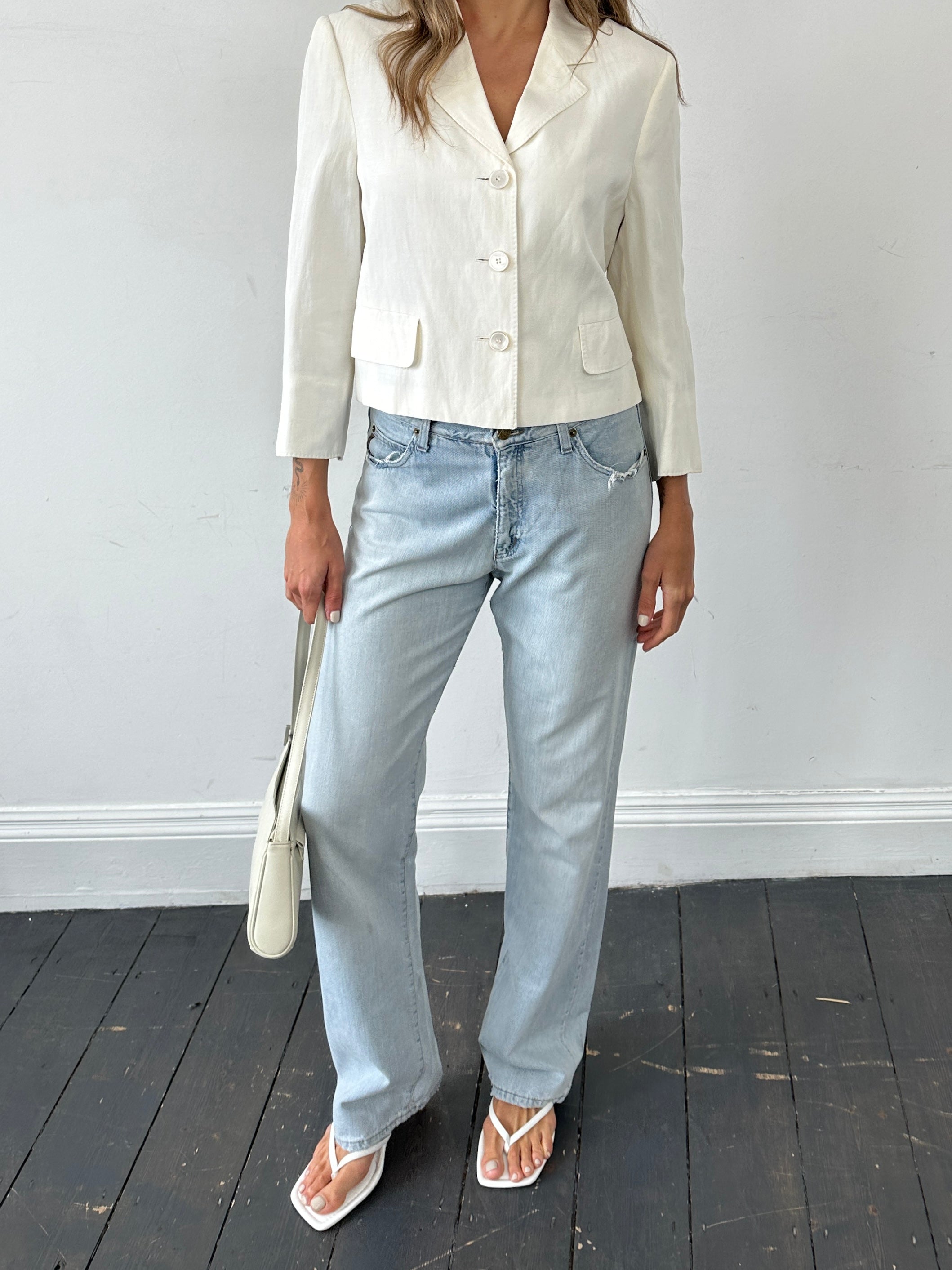 Armani Jeans light wash mid-rise denim jeans with W30 waist, shown laid flat to highlight classic fit and stitching details.
