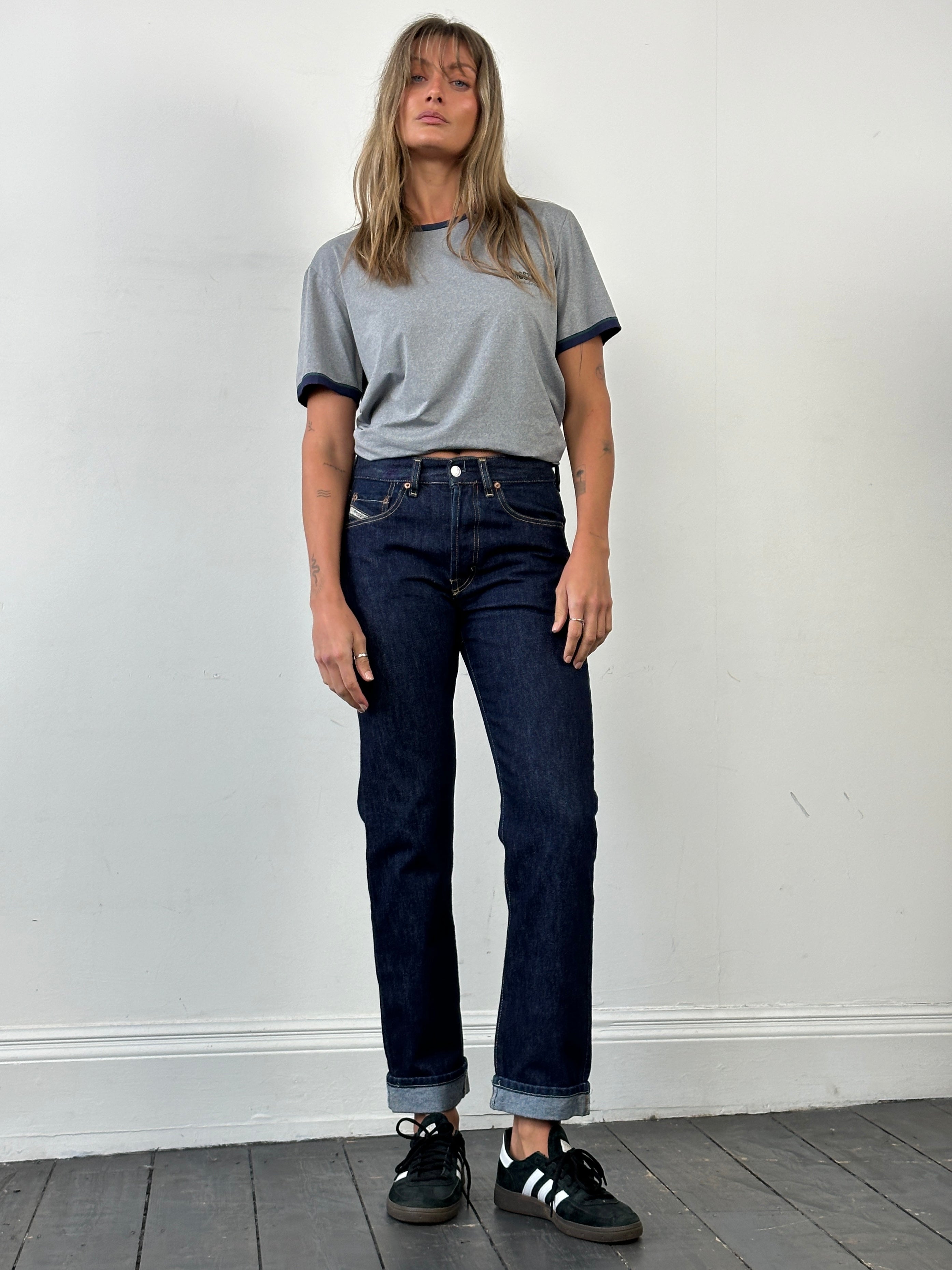 Diesel 575 Cochise 90s straight leg denim jeans in size W28, showing front view with classic blue denim and stitching details.