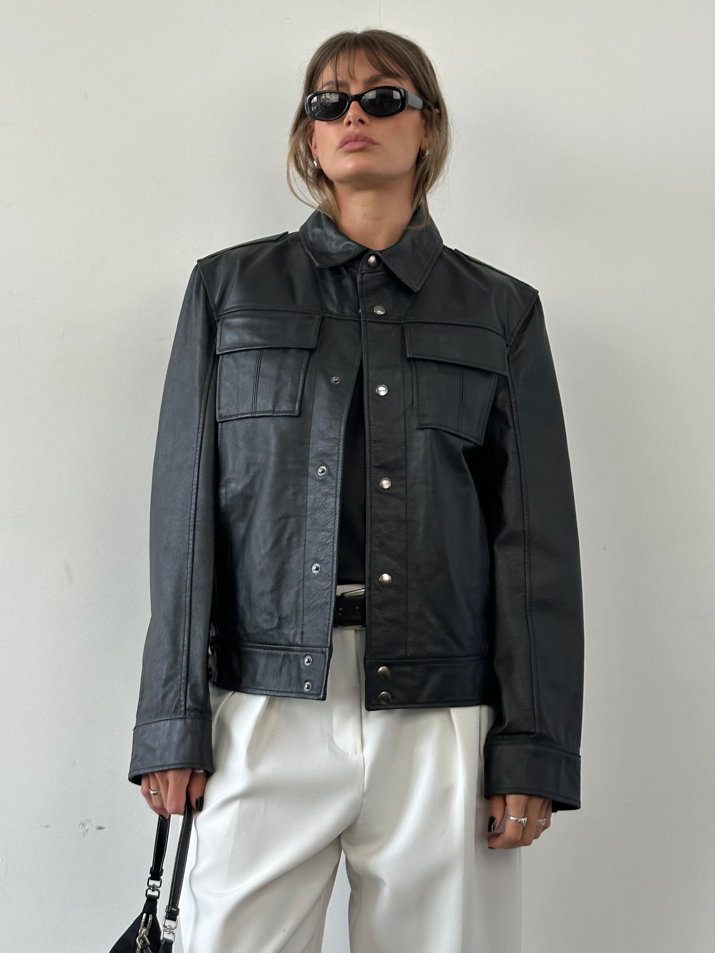 Vintage Conbipel leather jacket in size M, featuring a classic vintage design with smooth leather and stylish details.