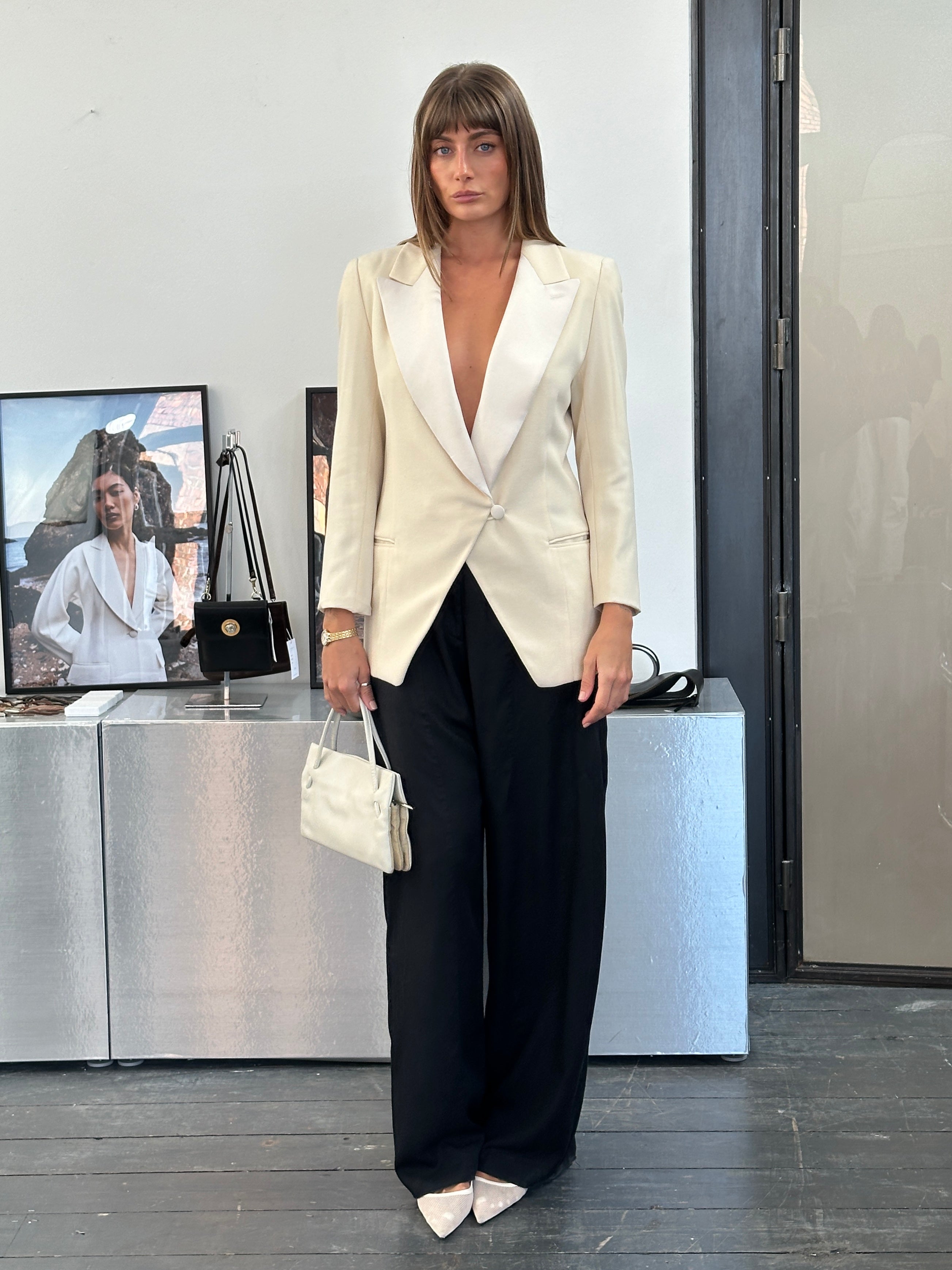 Giorgio Armani 1980s wool satin tuxedo blazer in black, tailored fit with satin lapels, styled on a mannequin.