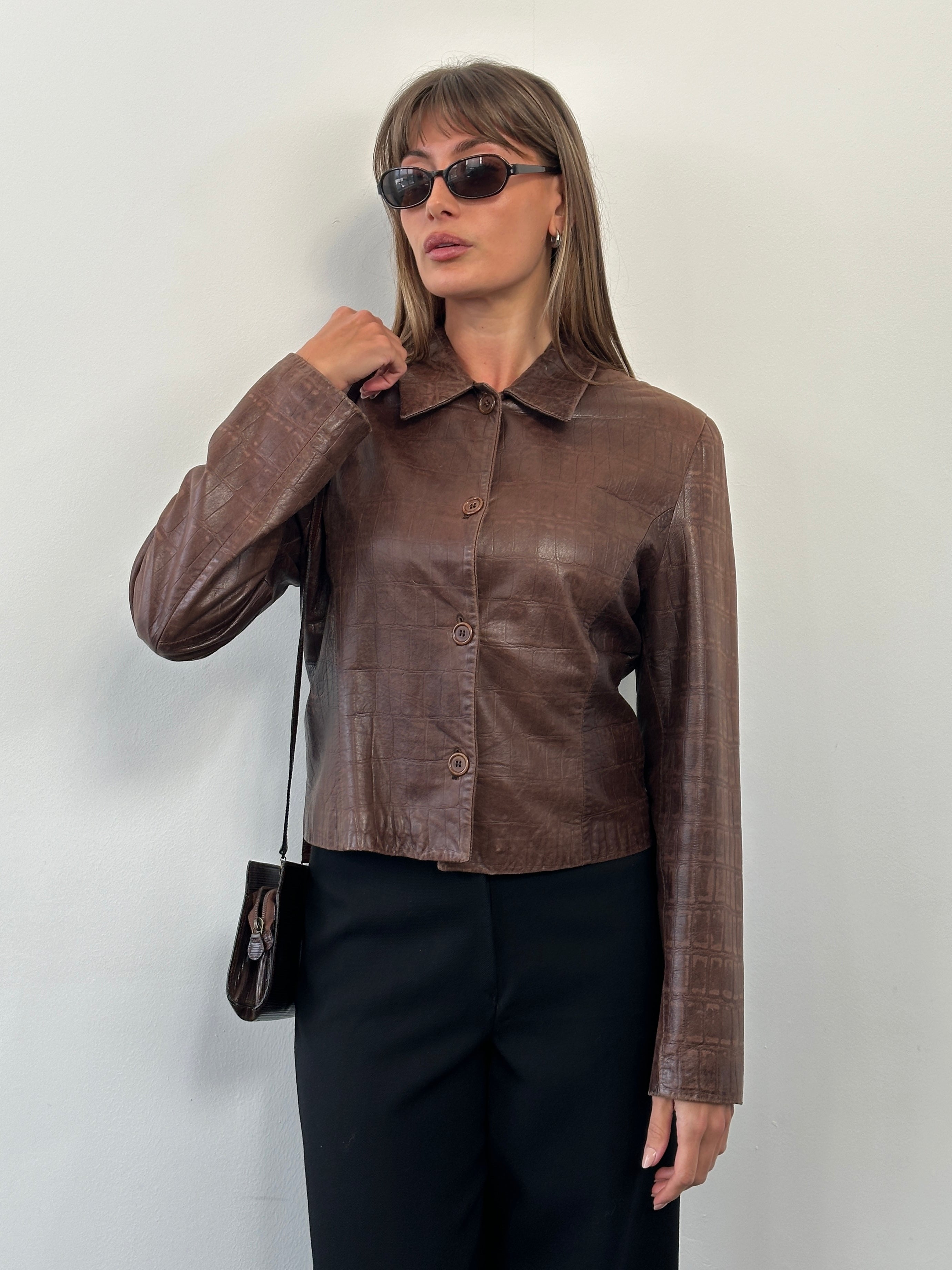 Emporio Armani 1990s leather jacket in size S/M, black genuine leather with classic design and detailed stitching.