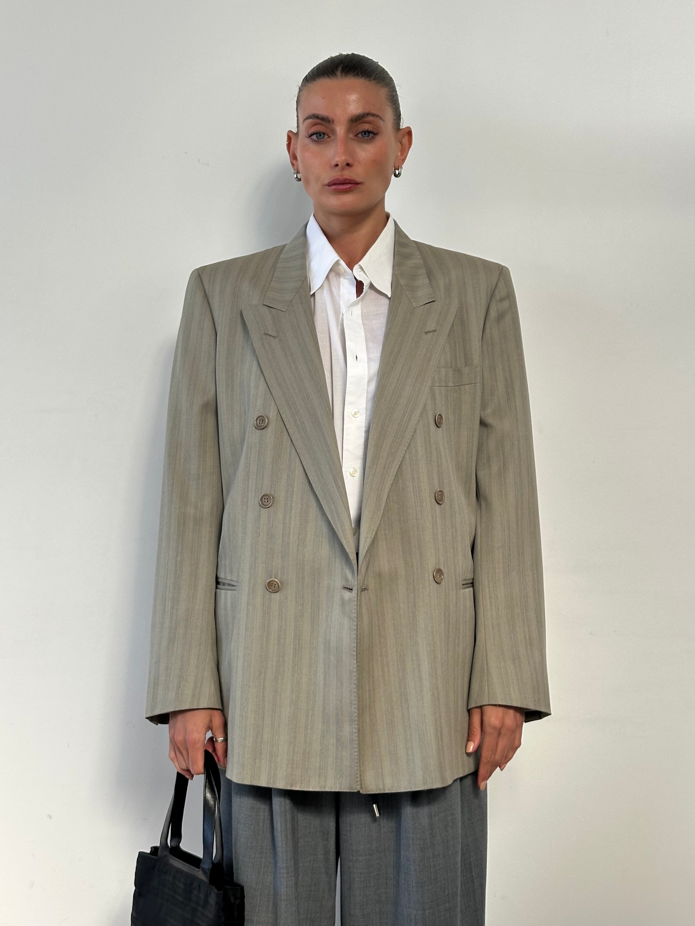 Vintage Italian double-breasted wool blazer in size L, featuring classic tailoring and timeless vintage style.