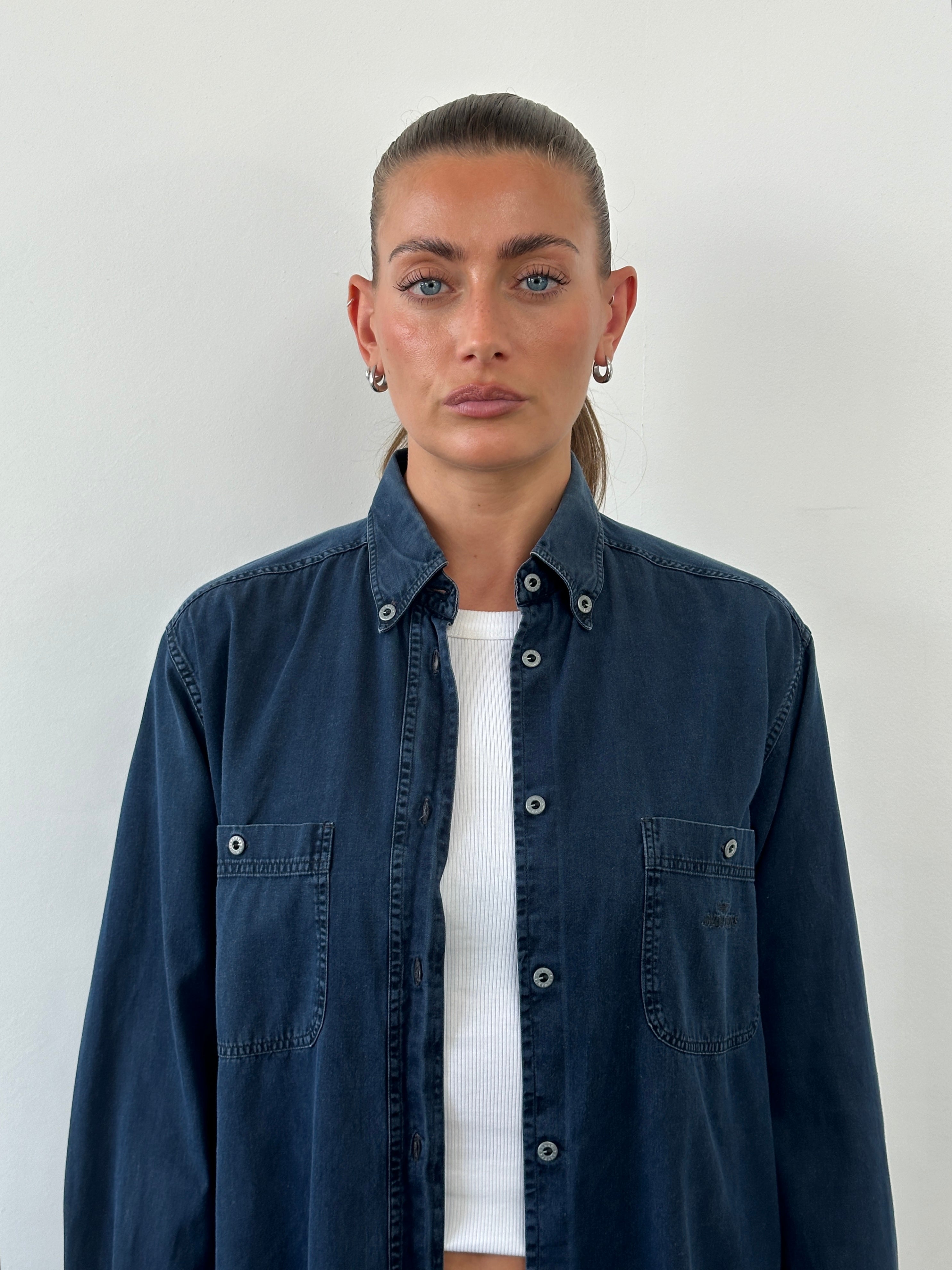 Armani Jeans denim logo shirt in size L, featuring classic denim fabric and the Armani logo on the front.