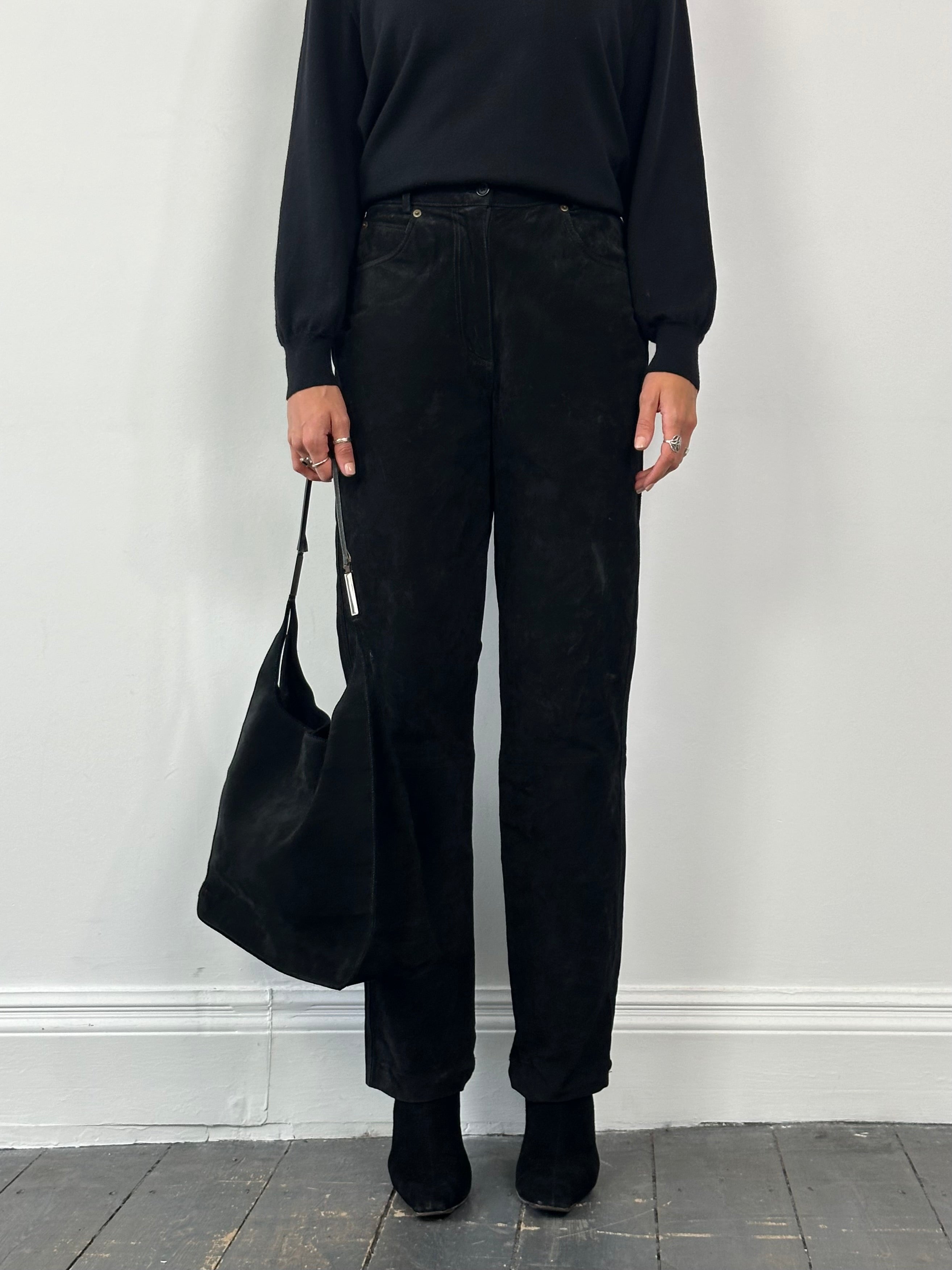 Vintage high waisted suede trousers in size W26, featuring a classic fit and soft, textured suede fabric.
