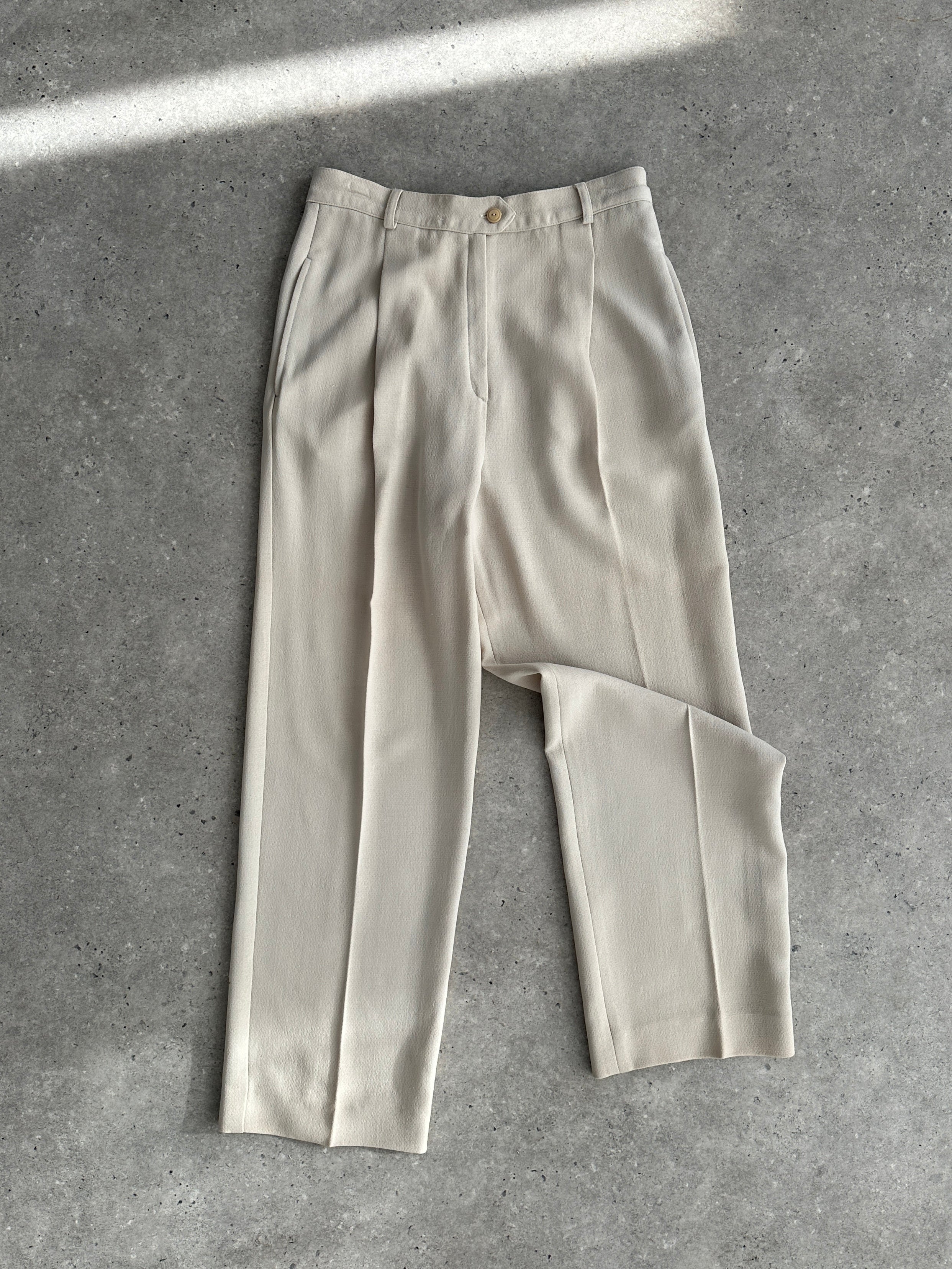 Max Mara pure wool straight leg tailored trousers in W28, showcasing a sleek fit and classic design on a neutral background.