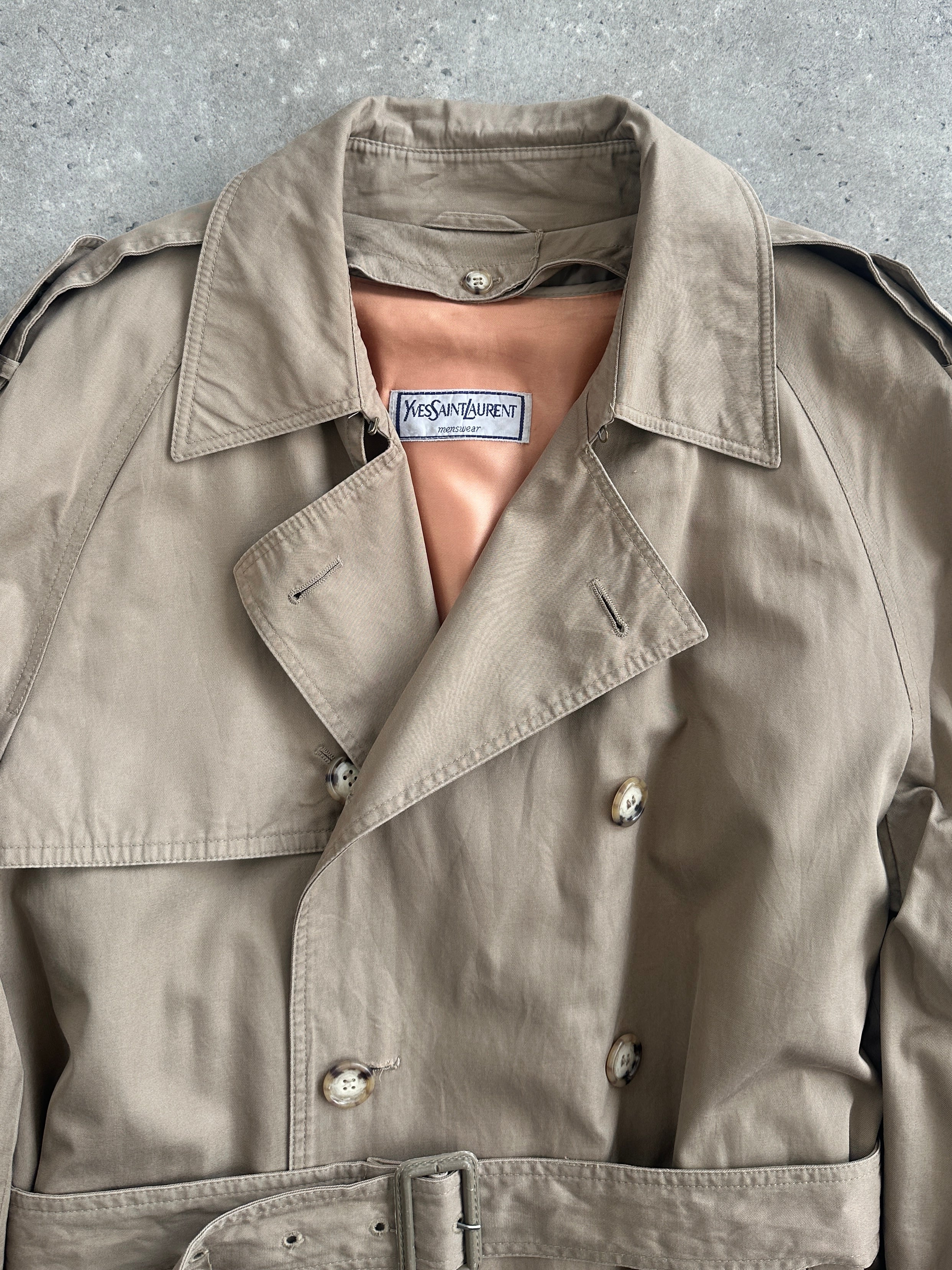 Yves Saint Laurent 80s pure cotton double-breasted belted trench coat in XL, classic beige color, displayed on a hanger