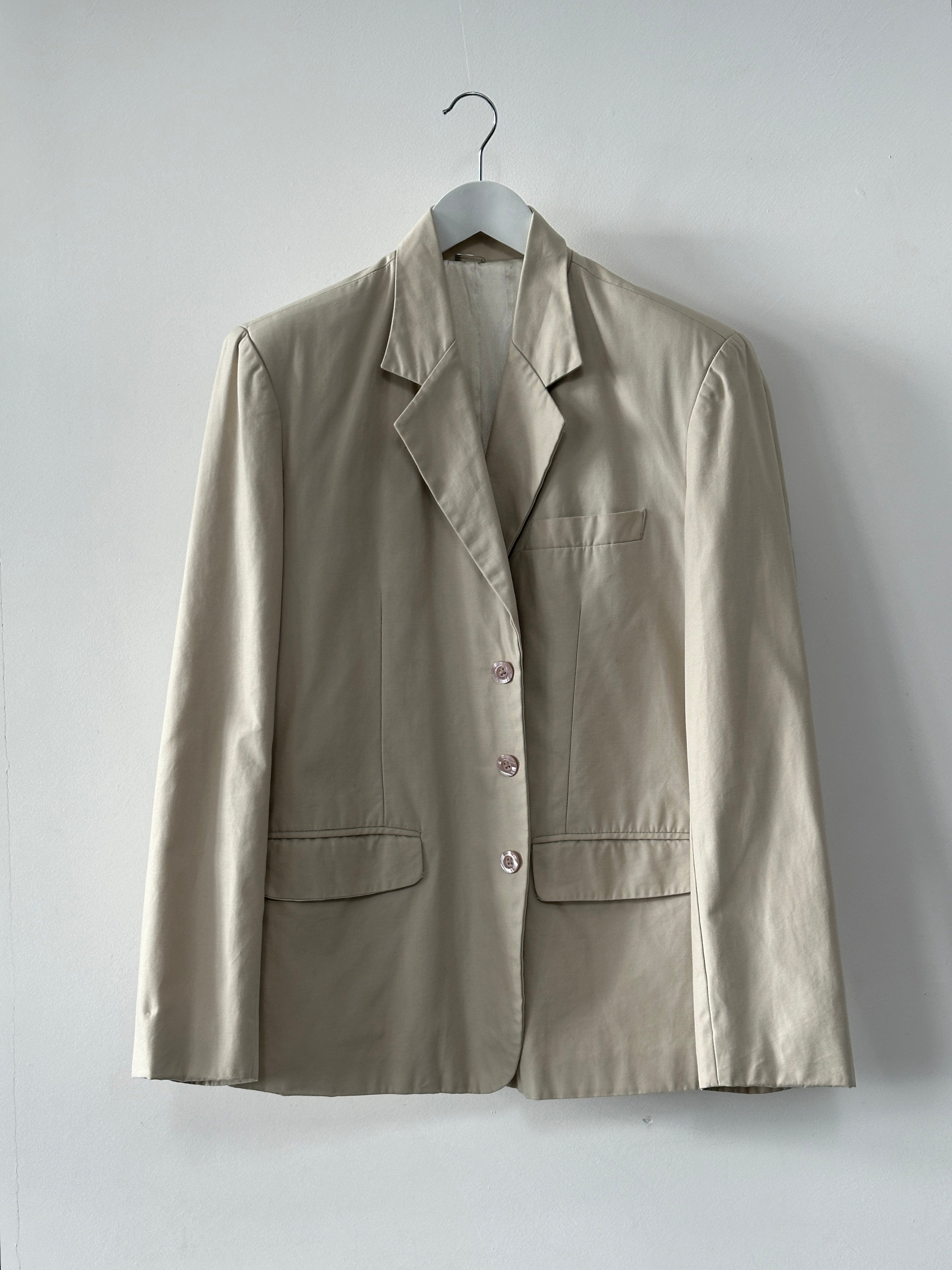 Vintage cotton single-breasted blazer in size L, featuring classic design and tailored fit, displayed on a neutral background.