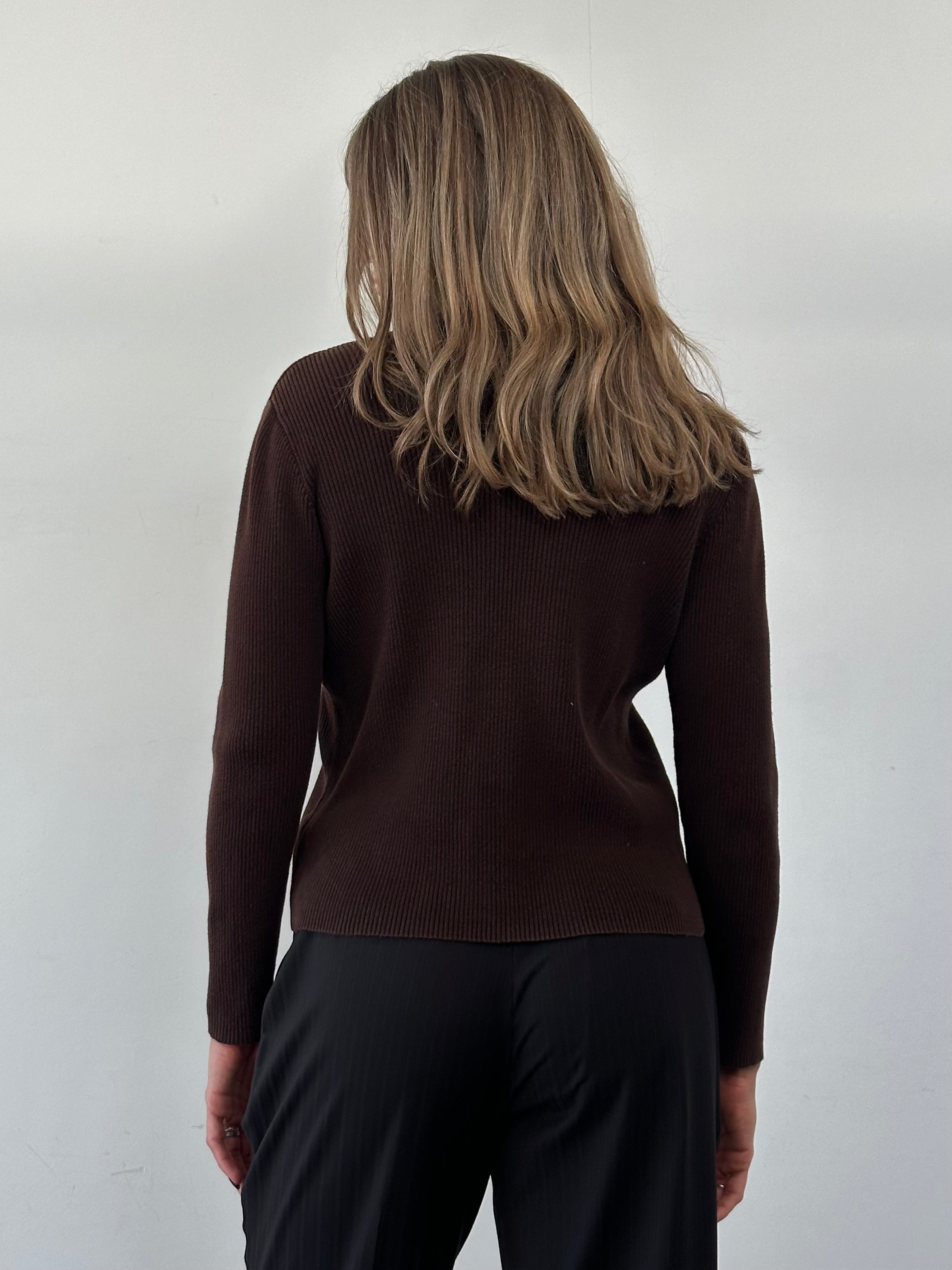 Ralph Lauren rib knit turtle neck jumper in size M, soft beige color, close-up of the textured knit fabric.