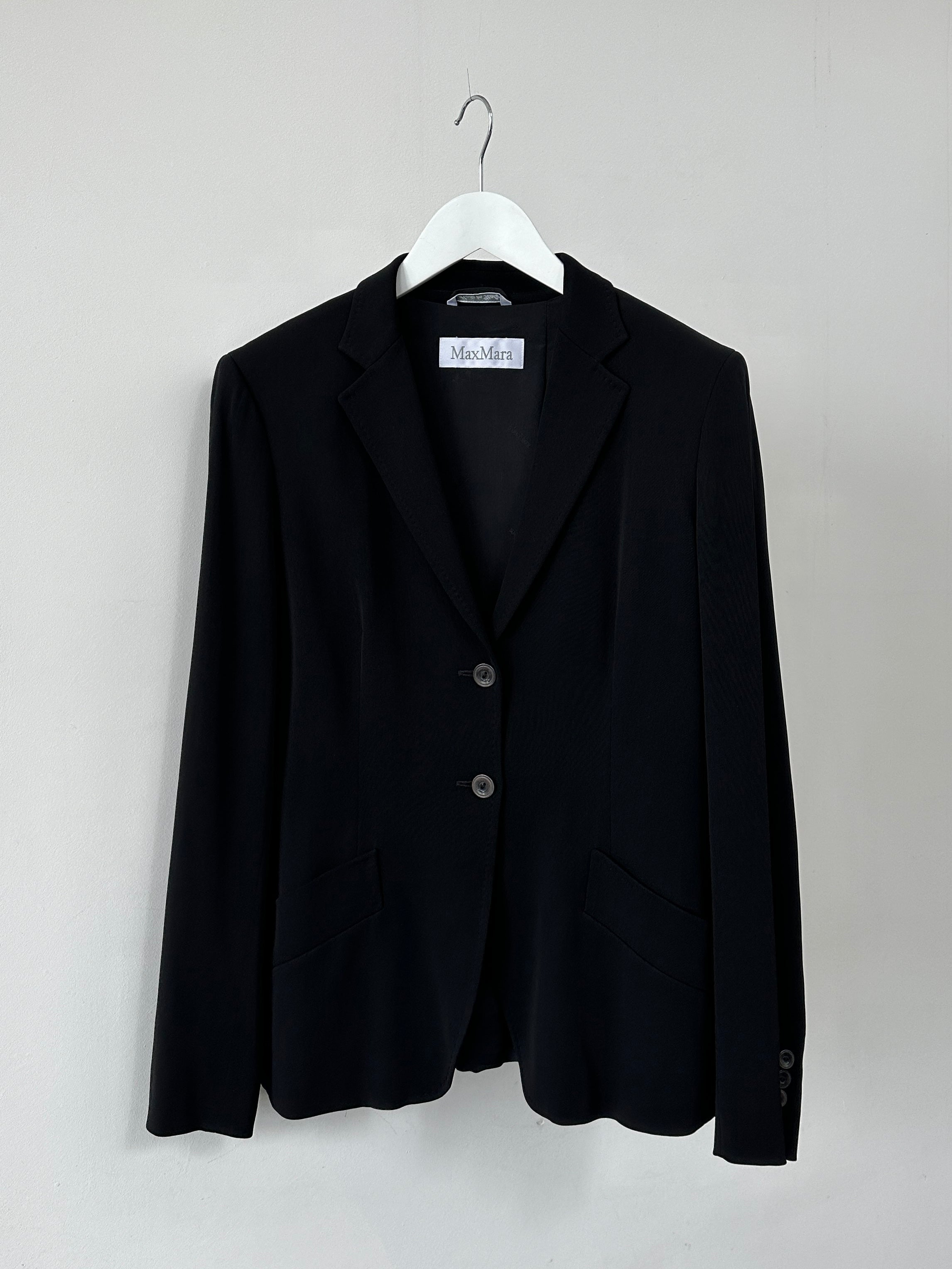 Max Mara wool silk single-breasted blazer in size M, tailored fit, featuring classic lapels and a sleek design.