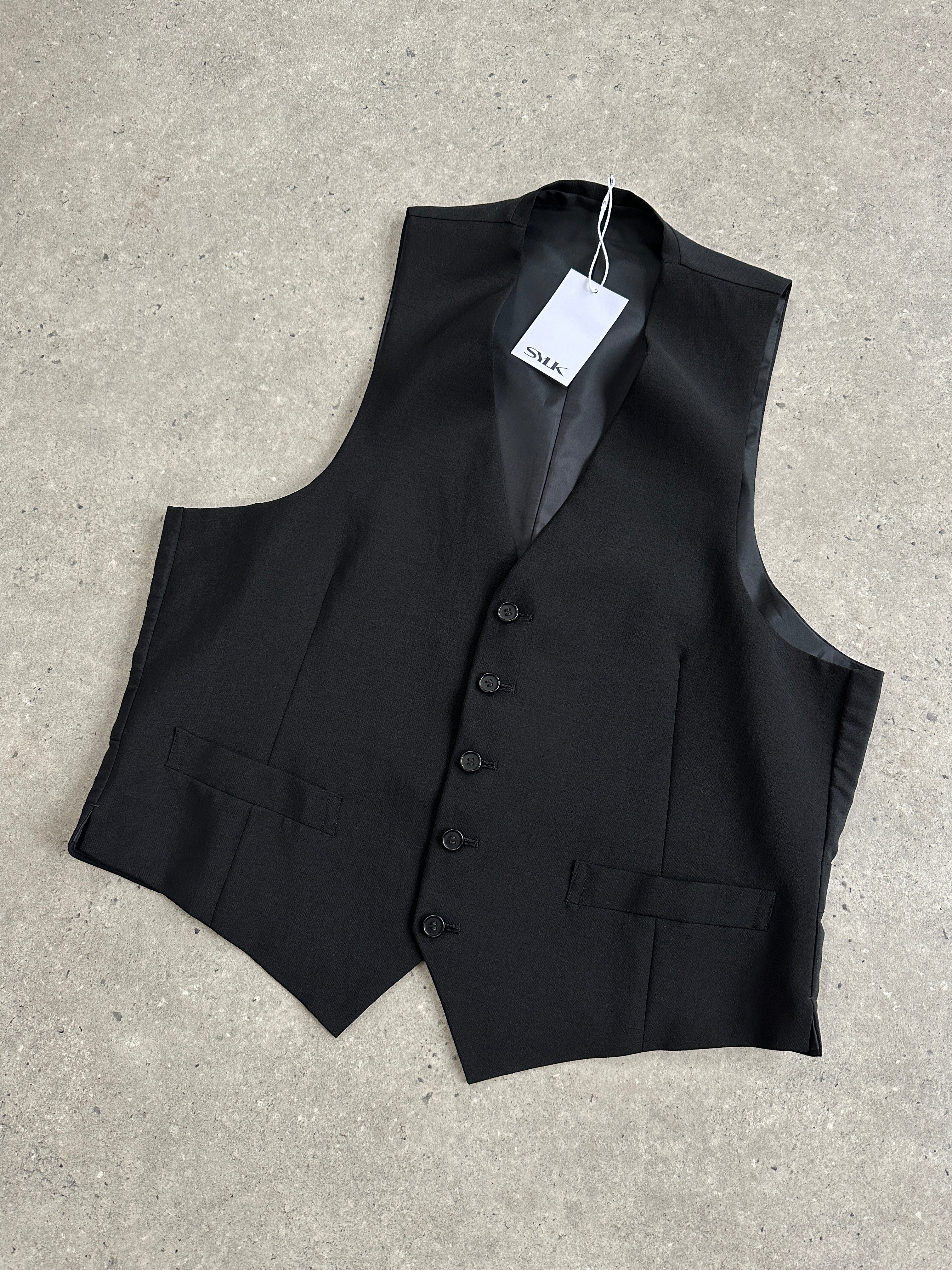 Vintage pure wool tailored waistcoat in size L, featuring classic design and button closure, displayed on a neutral background.
