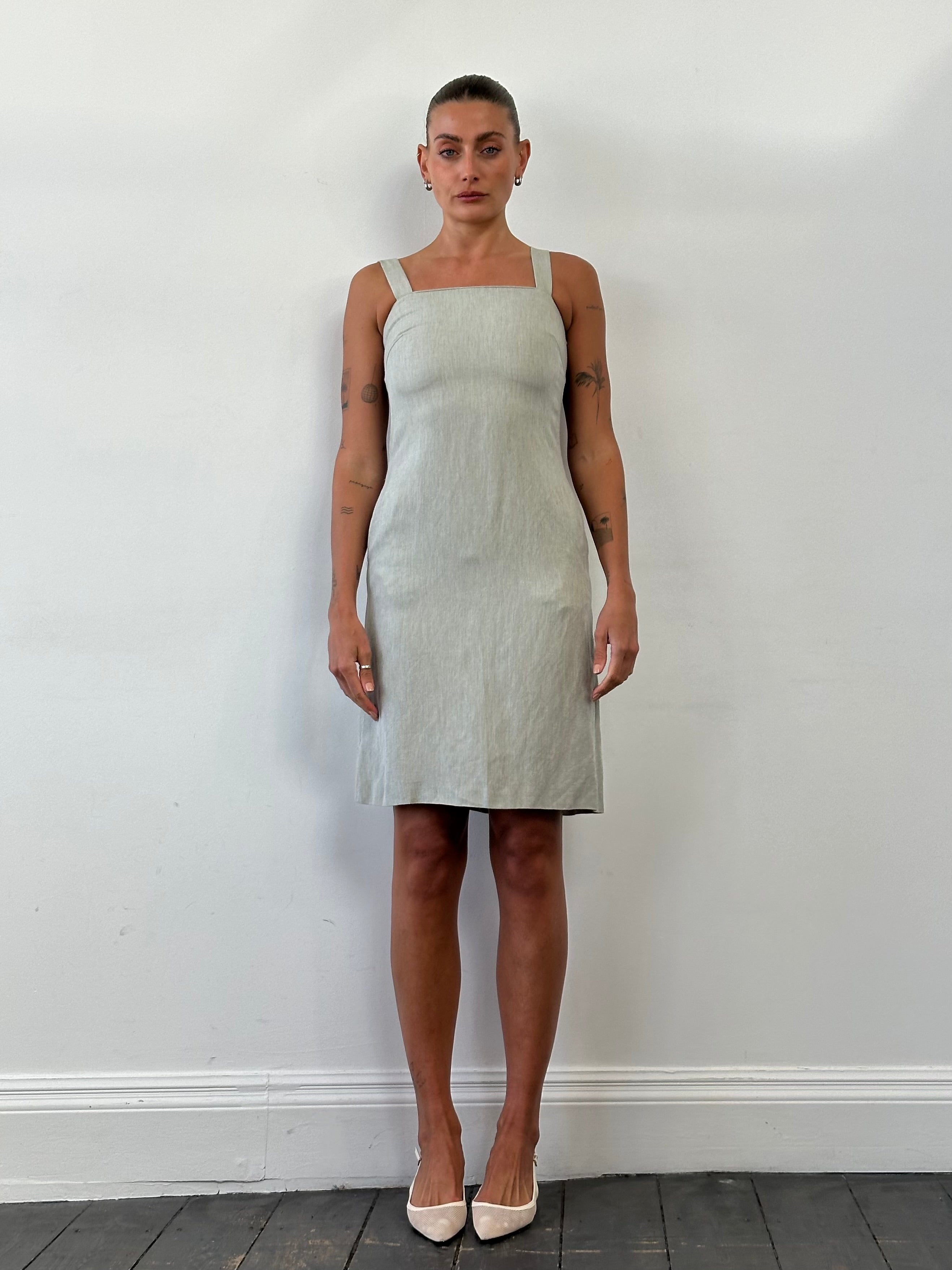 Marella linen midi dress in XS/S displayed on a hanger, showcasing its lightweight fabric and relaxed fit.