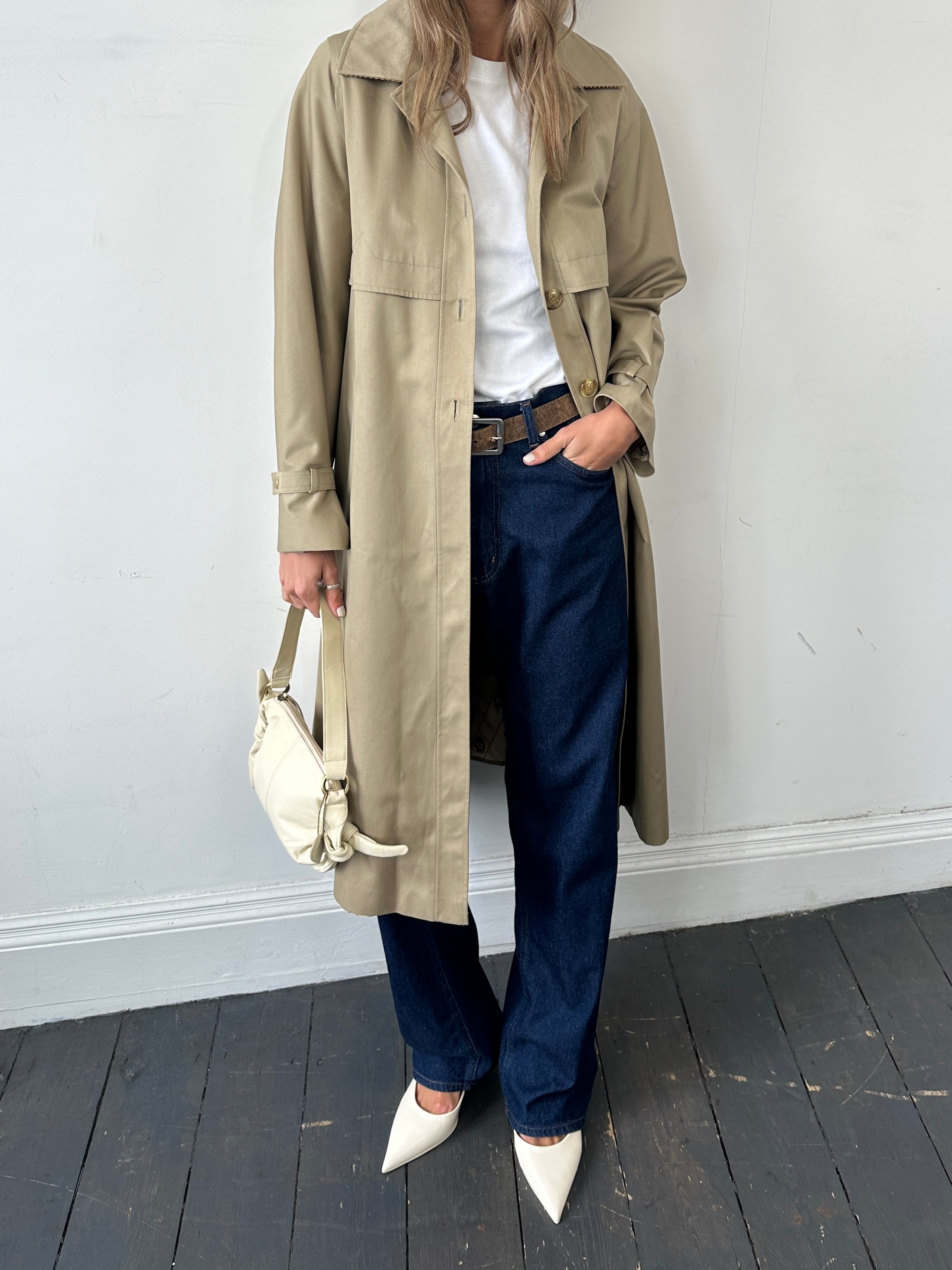 Vintage single-breasted trench coat in size S, classic style with belt and button details, displayed on a hanger.