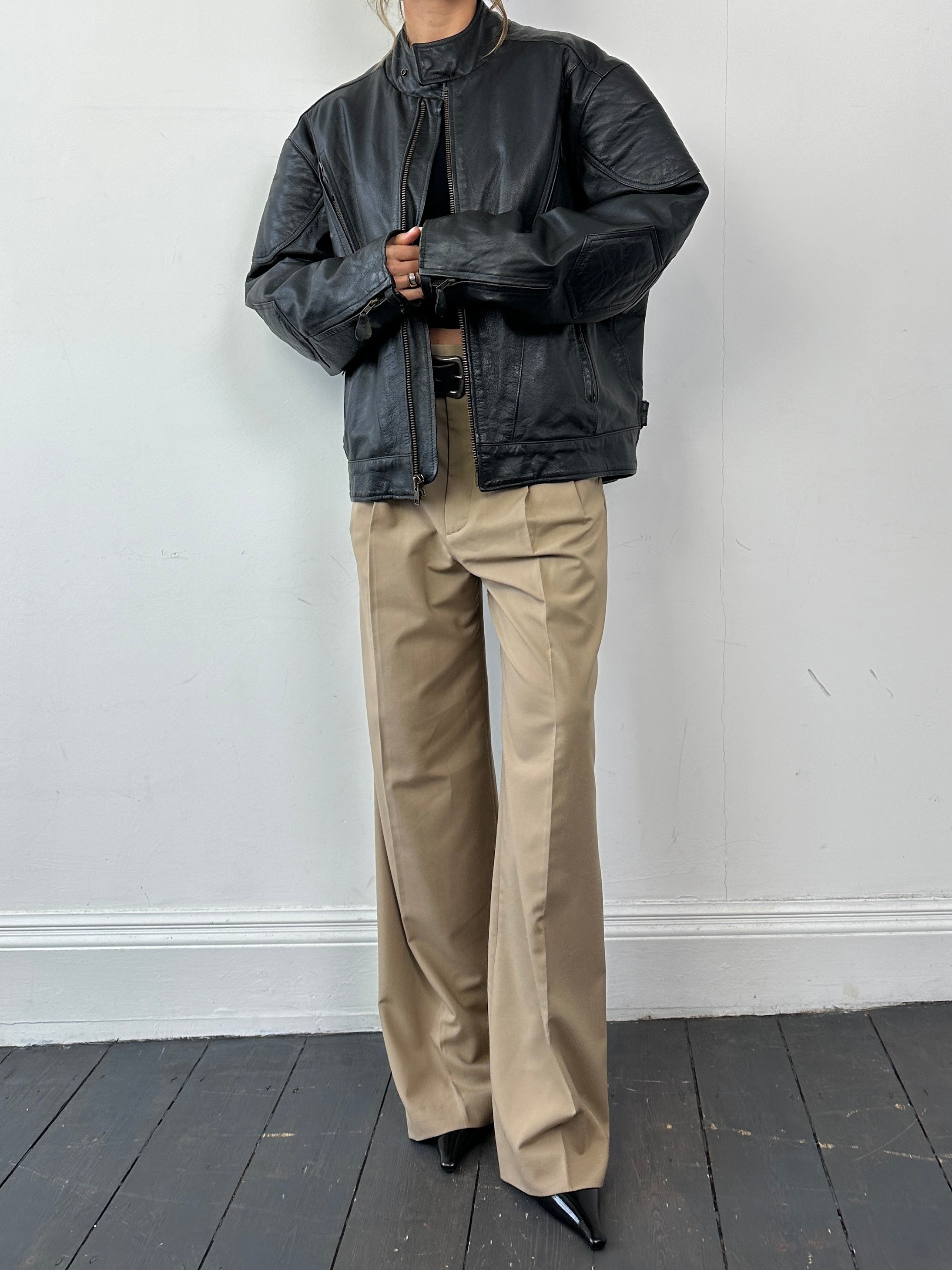 Vintage leather motorcycle jacket in XL size, featuring classic design, sturdy leather material, and detailed stitching.