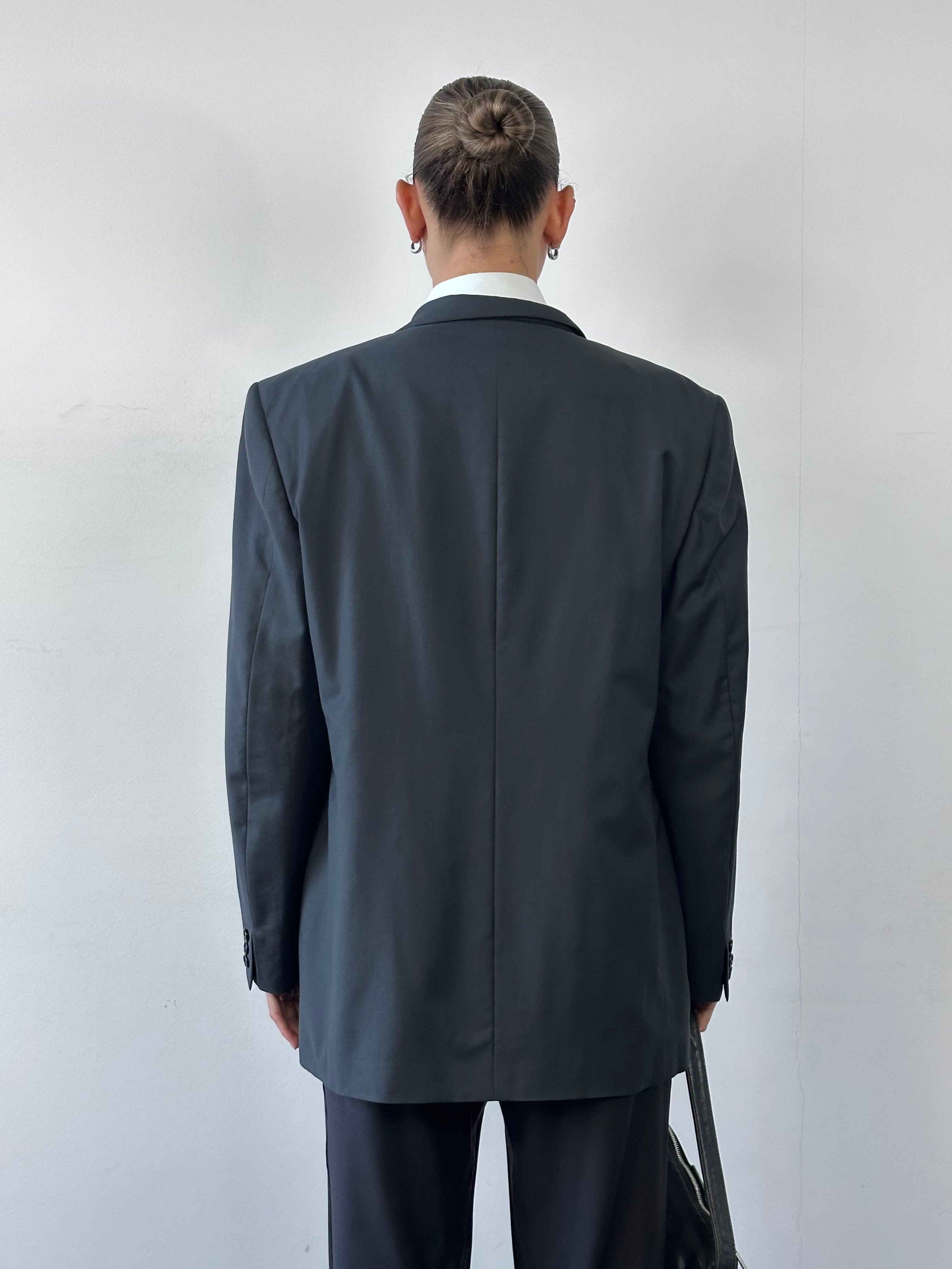Yves Saint Laurent 70s wool single-breasted blazer in size 44R/XL, tailored fit with classic lapel and button closure.