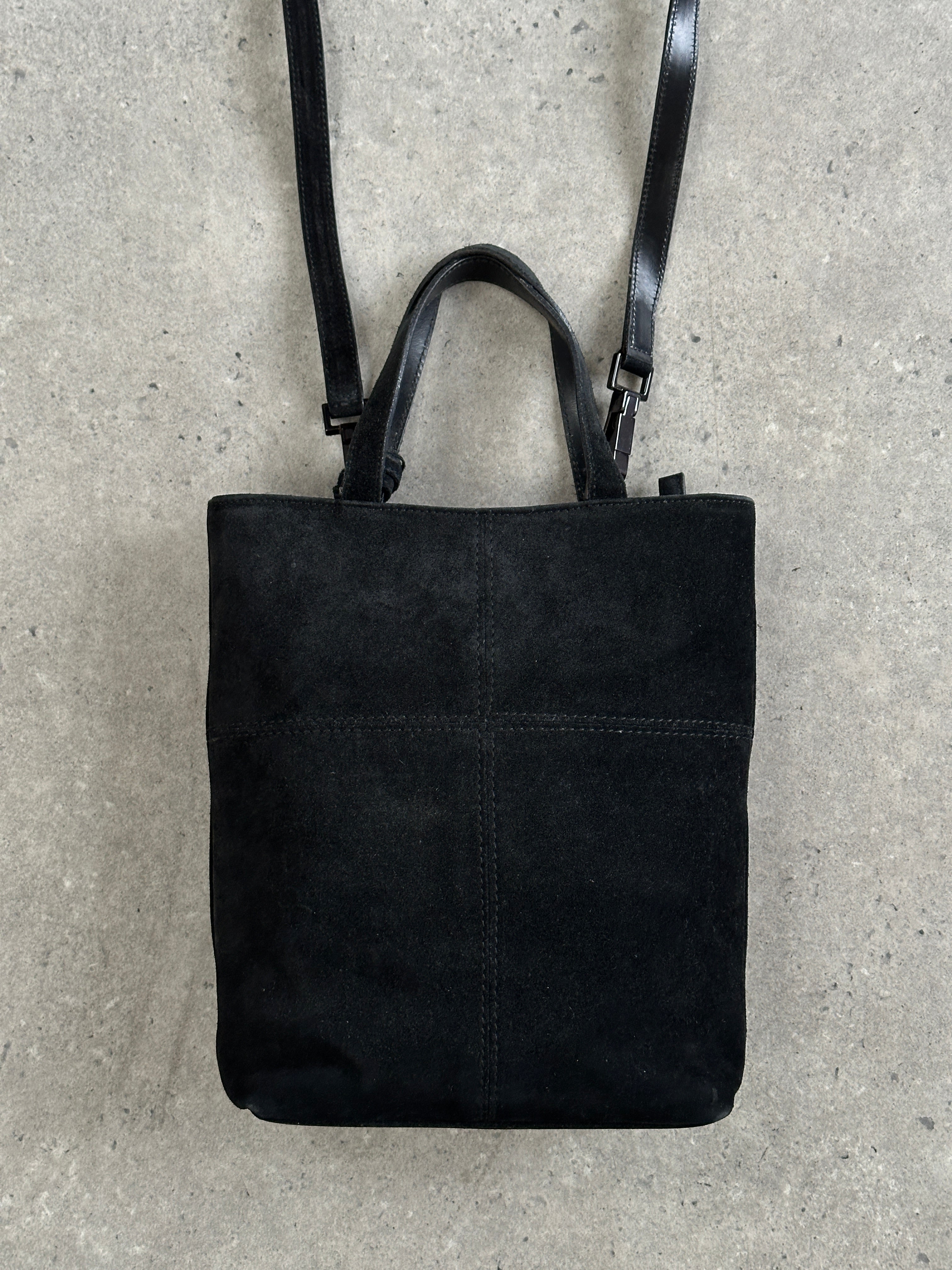 Gucci 2000s suede top handle crossbody bag with structured design and adjustable strap, featuring iconic branding details.