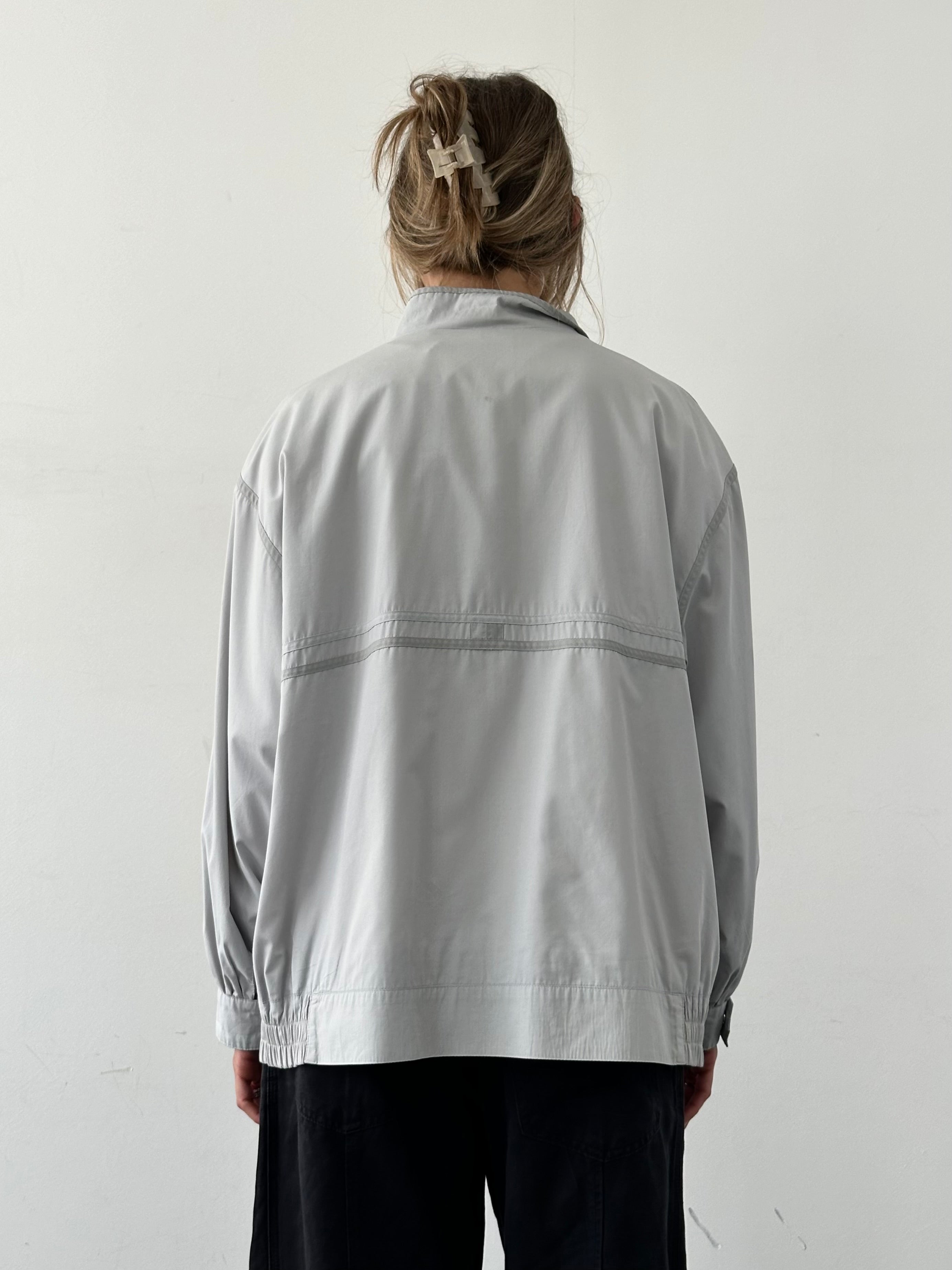 Vintage 2000s high neck bomber jacket in XL with classic style, featuring a zip front and ribbed cuffs and hem.