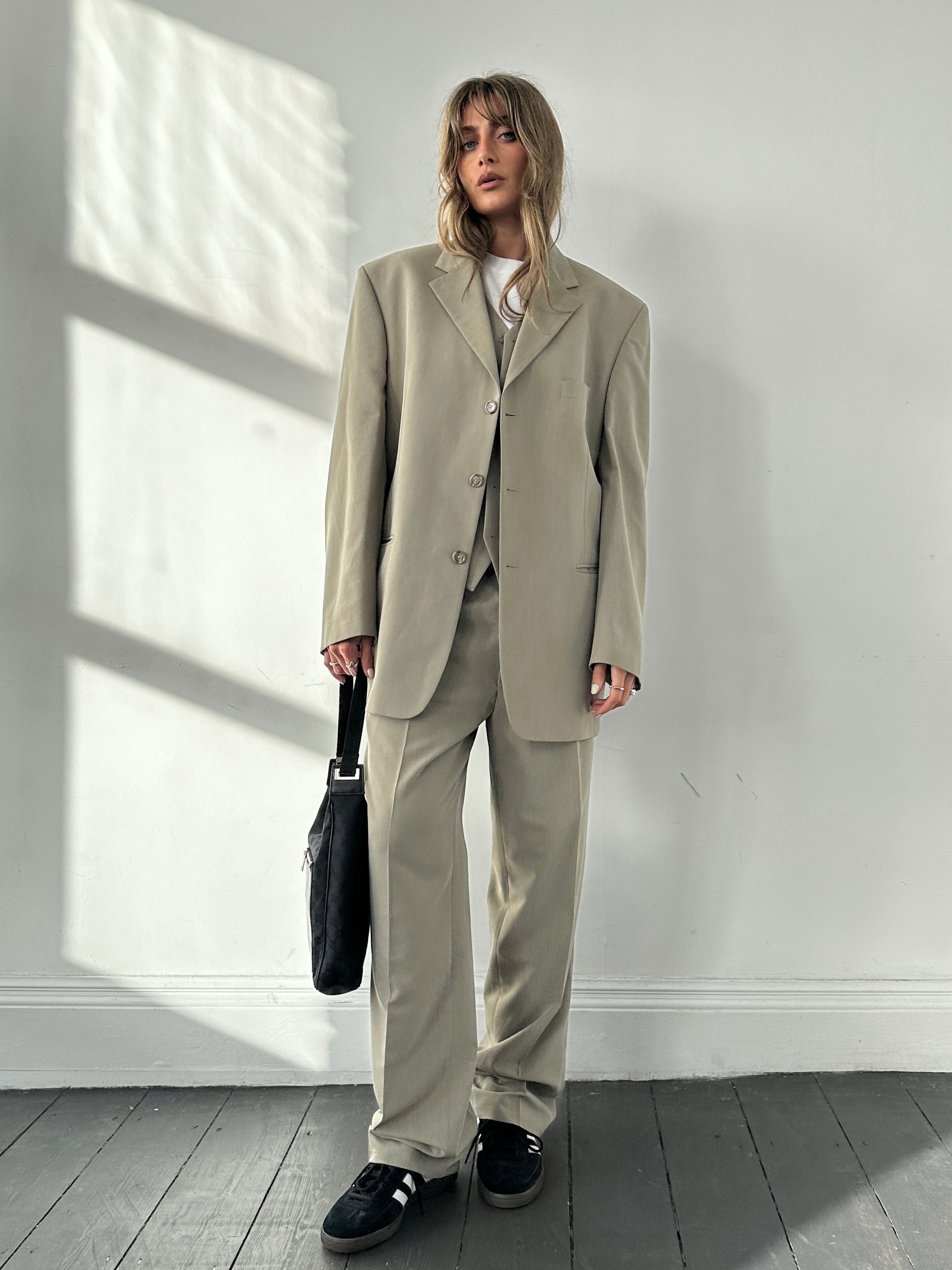 Pierre Cardin three-piece suit in size 44R/W34, featuring a tailored jacket, vest, and matching trousers, displayed on a hanger.
