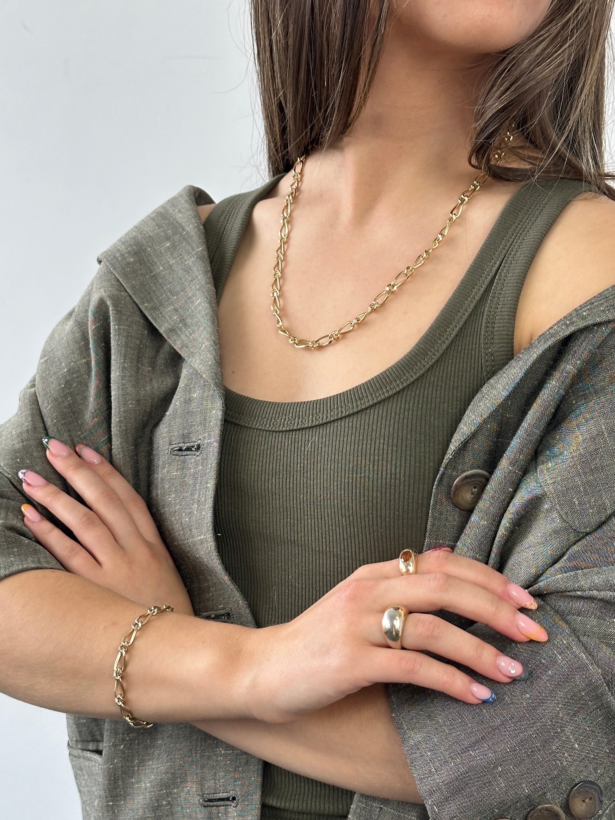 Pierre Cardin gold plated necklace and bracelet chain set, featuring sleek, matching jewelry with a polished finish.