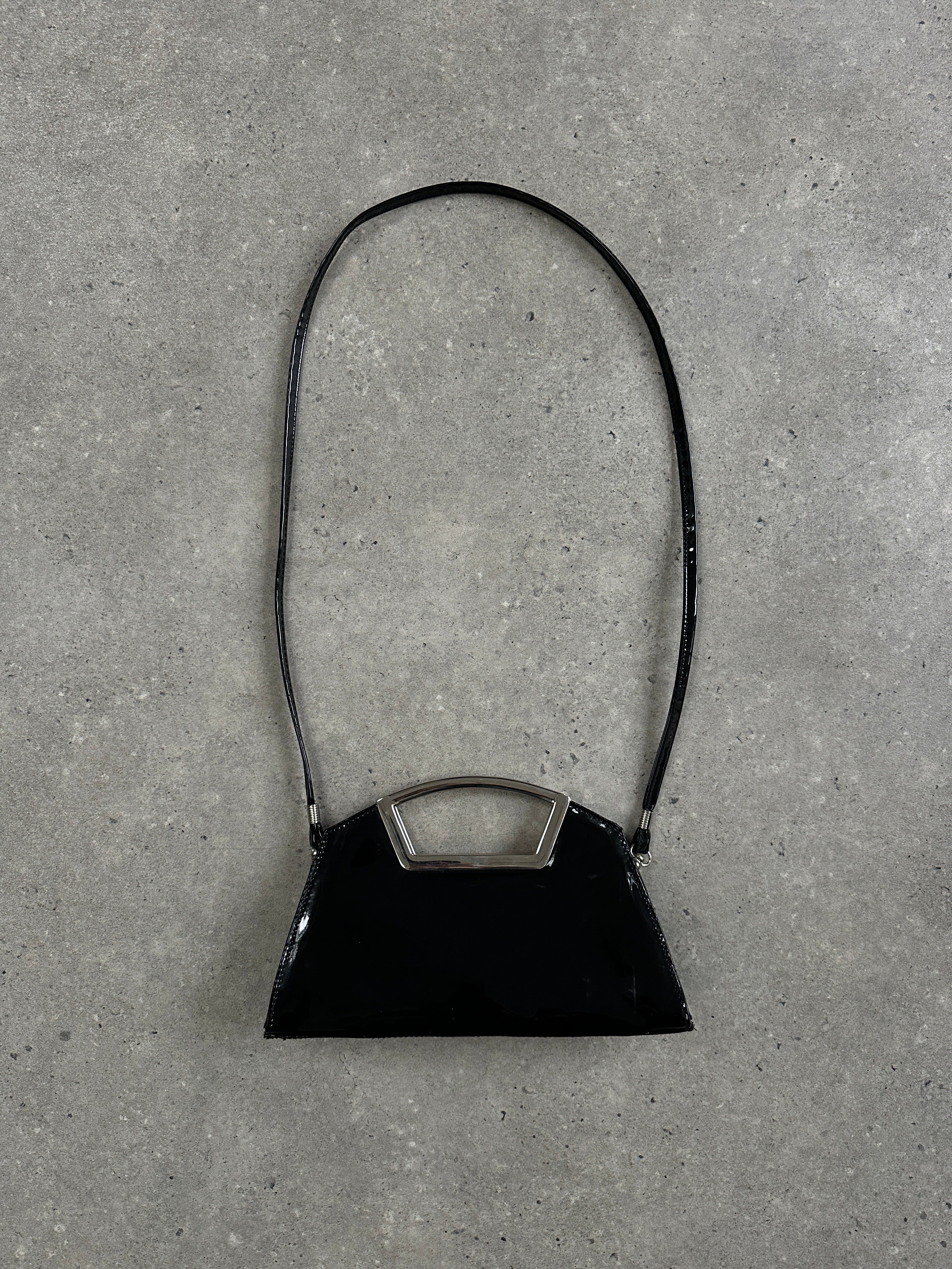 Vintage 2000s patent vinyl chrome crossbody clutch bag with sleek design and metallic finish.