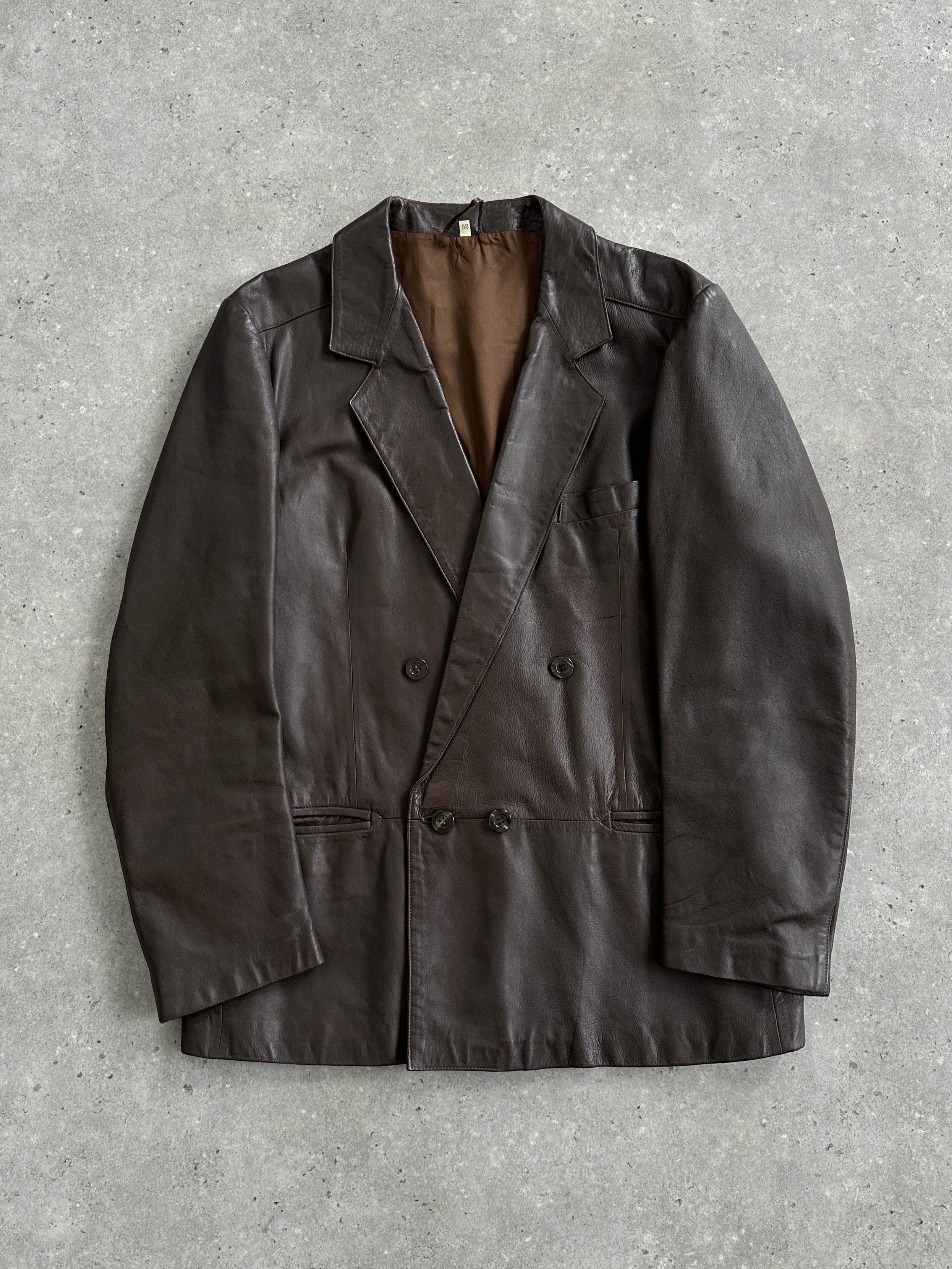 Vintage double-breasted leather blazer jacket in size L, featuring classic lapels and tailored fit, displayed on a hanger.