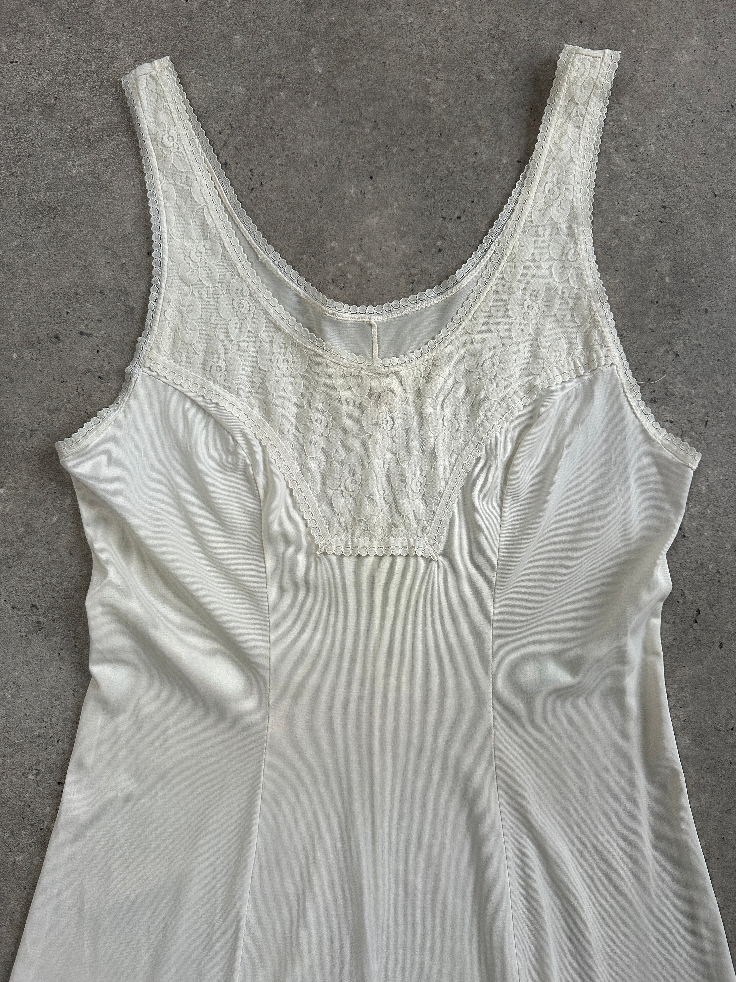 Vintage 1990s lace mini slip dress in size S, featuring delicate lace details and a classic vintage style.