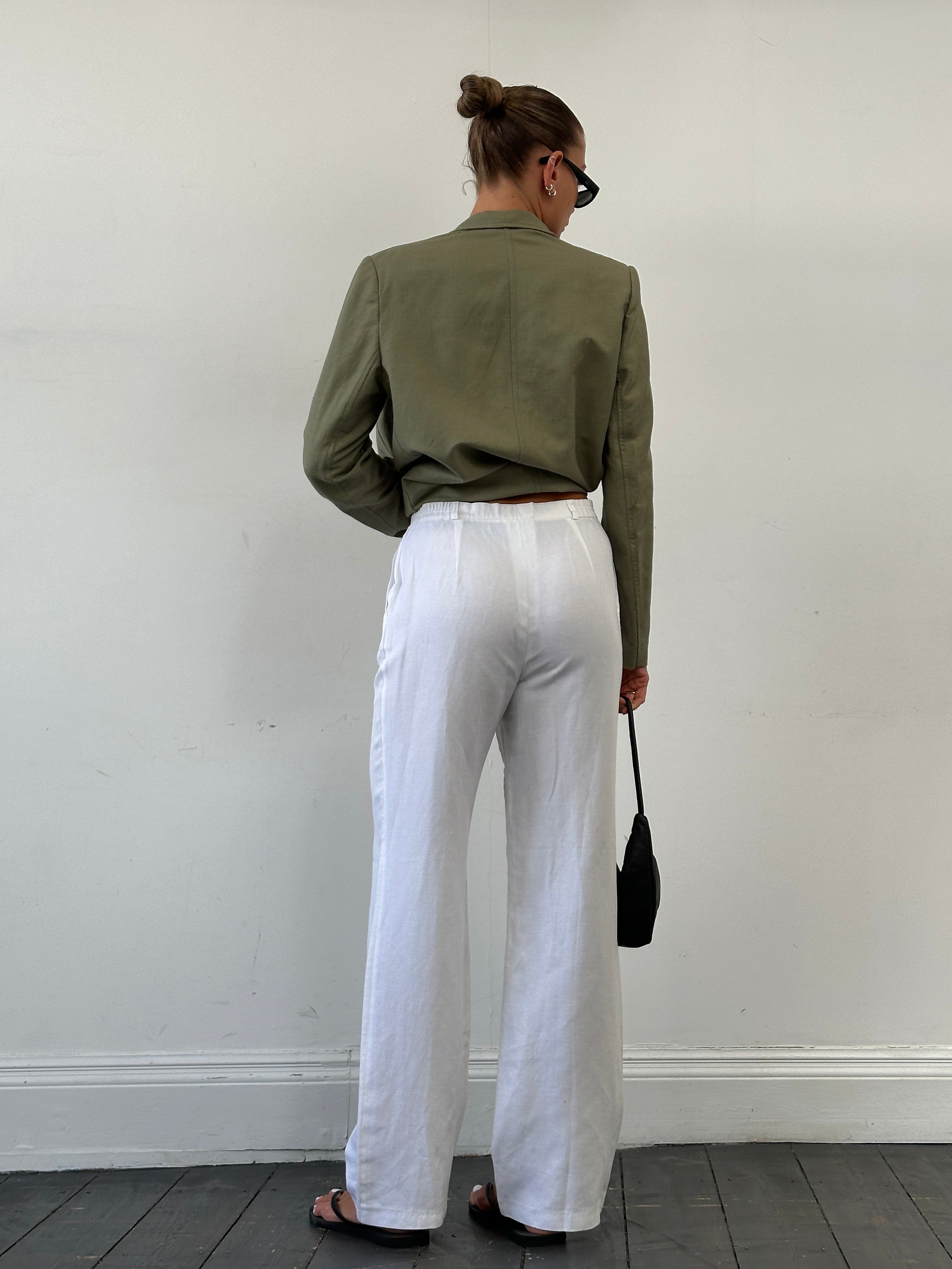 Vintage linen high waisted straight leg trousers in size W28, with classic fit and vintage style, shown on a neutral background.