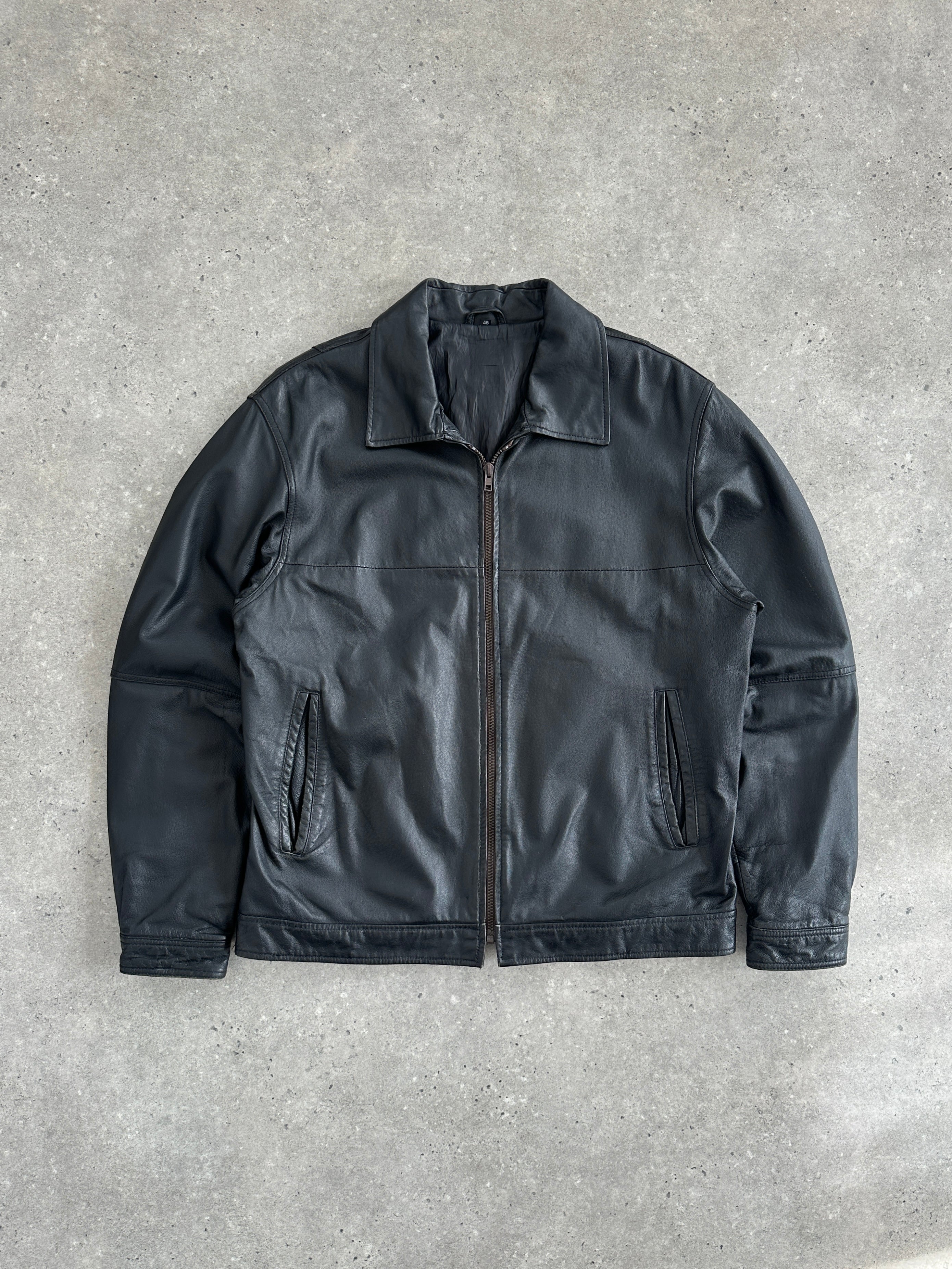 Vintage 1990s minimal leather jacket in size large to extra-large, classic design with clean lines and smooth leather finish.