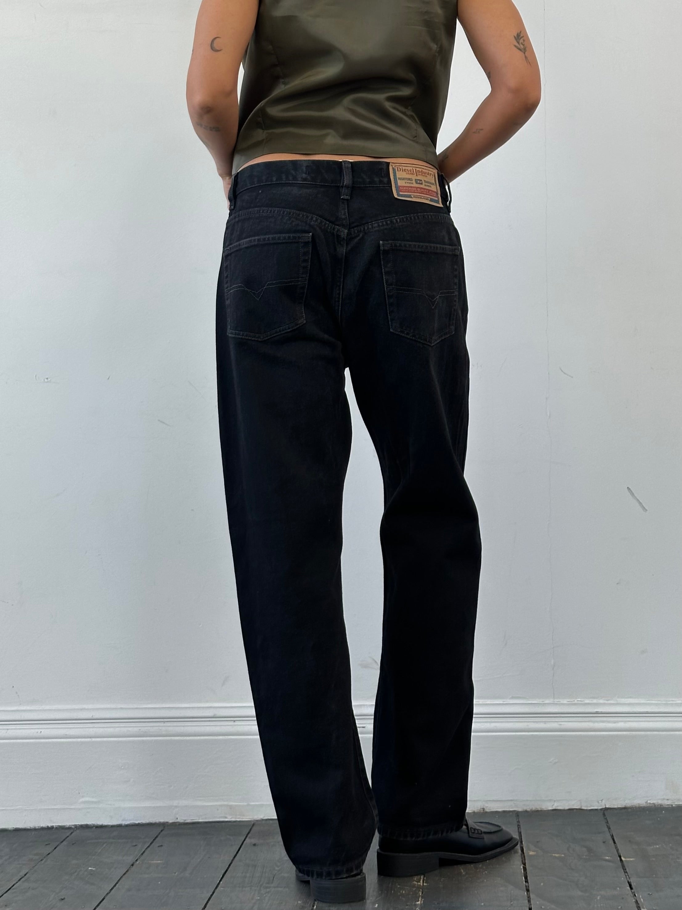 Diesel high waisted straight leg denim jeans in W32, showcasing classic blue denim with a fitted waist and relaxed leg silhouette.