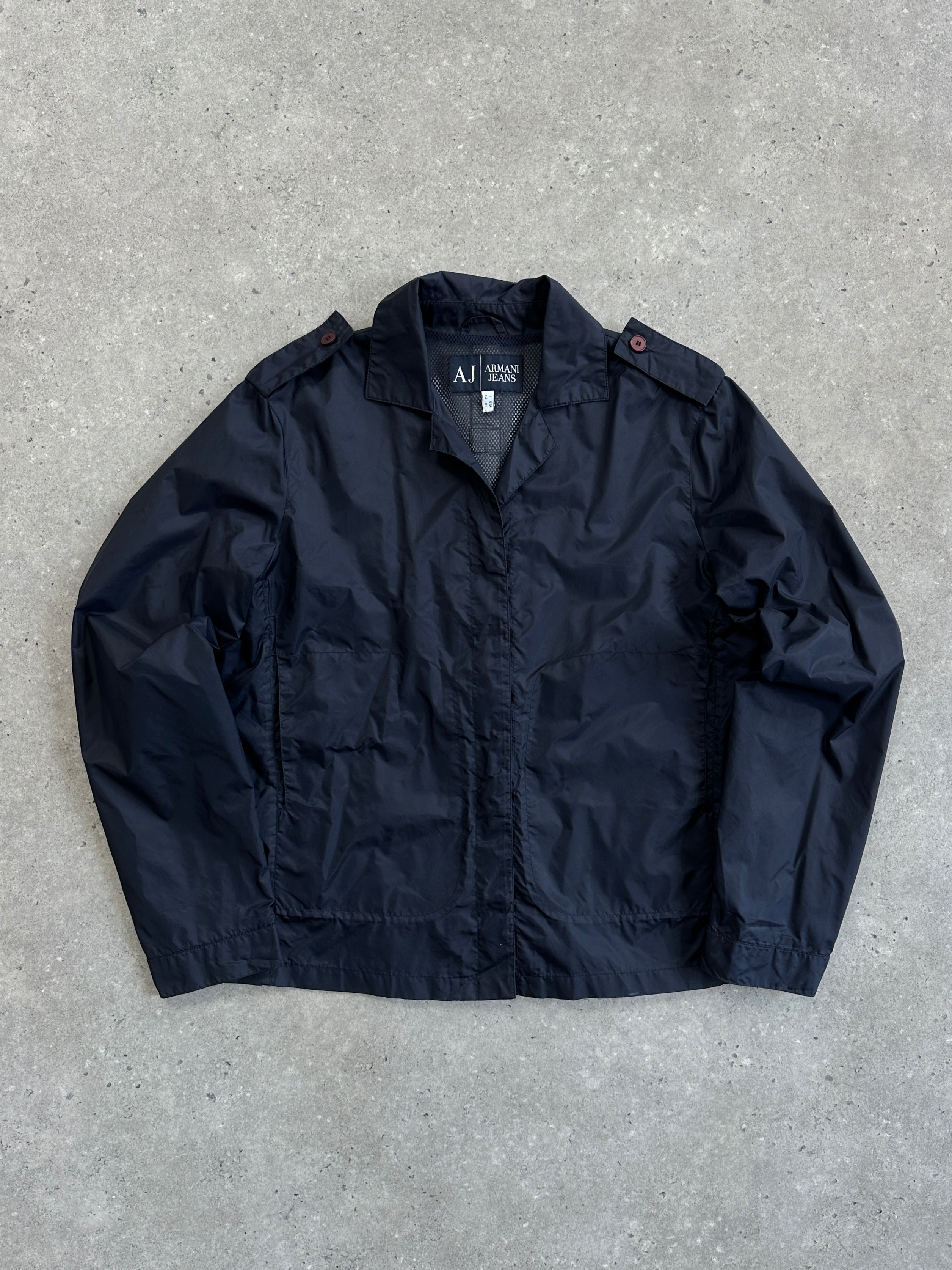 Armani Jeans 1990s showerproof nylon lightweight logo jacket in black, featuring a front zipper and brand logo on the chest.