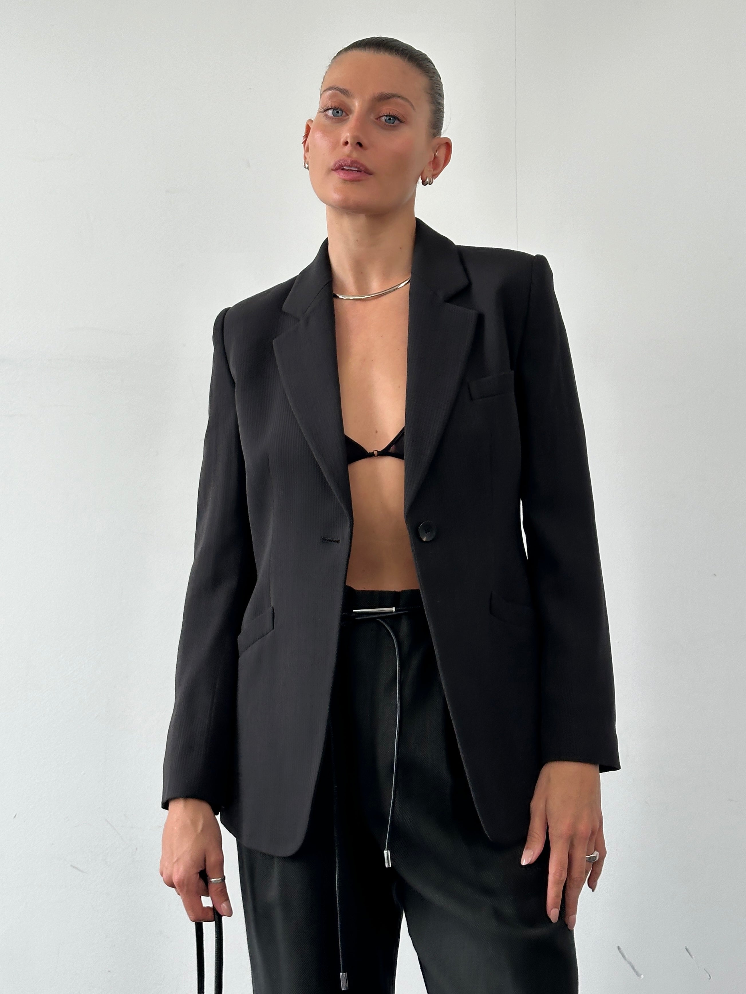 Armani Collezioni single button fitted blazer in classic black, tailored fit with notch lapel and sleek design.