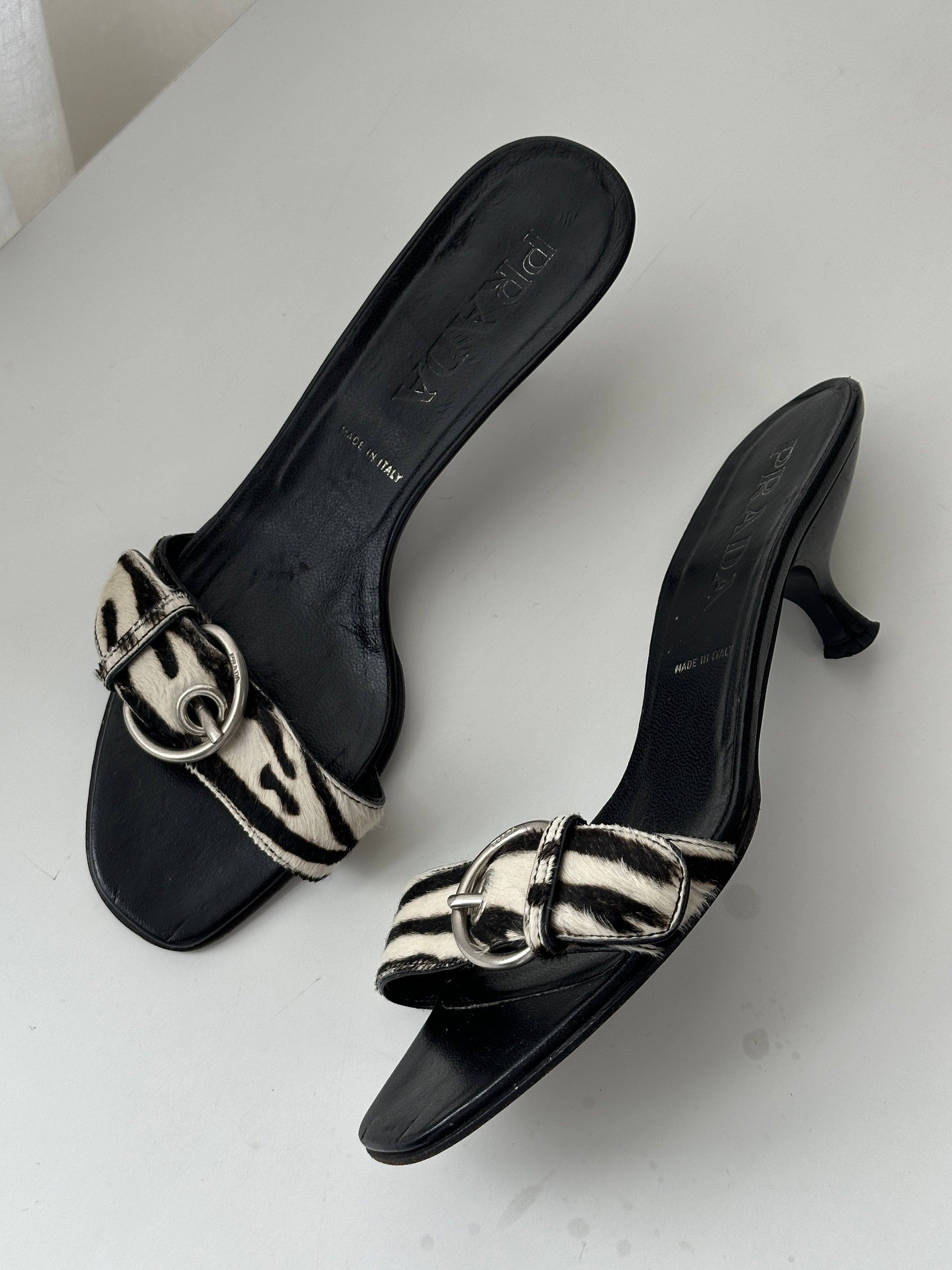 Prada zebra print pony hair kitten heels in UK 4.5, featuring pointed toe and elegant design.