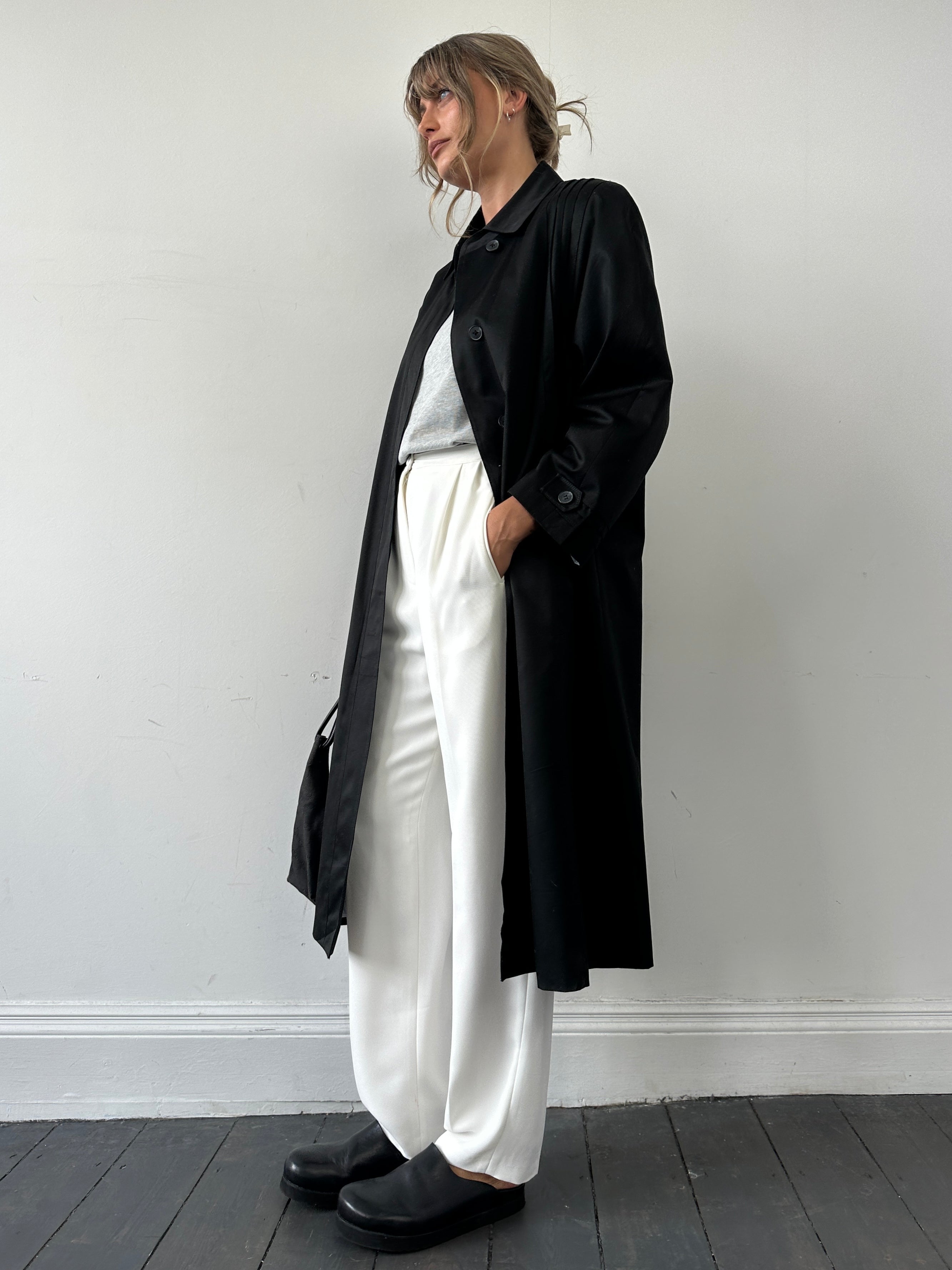 Vintage brand vintage pleated cotton trench coat in size M, showing classic collar and button details on the front.