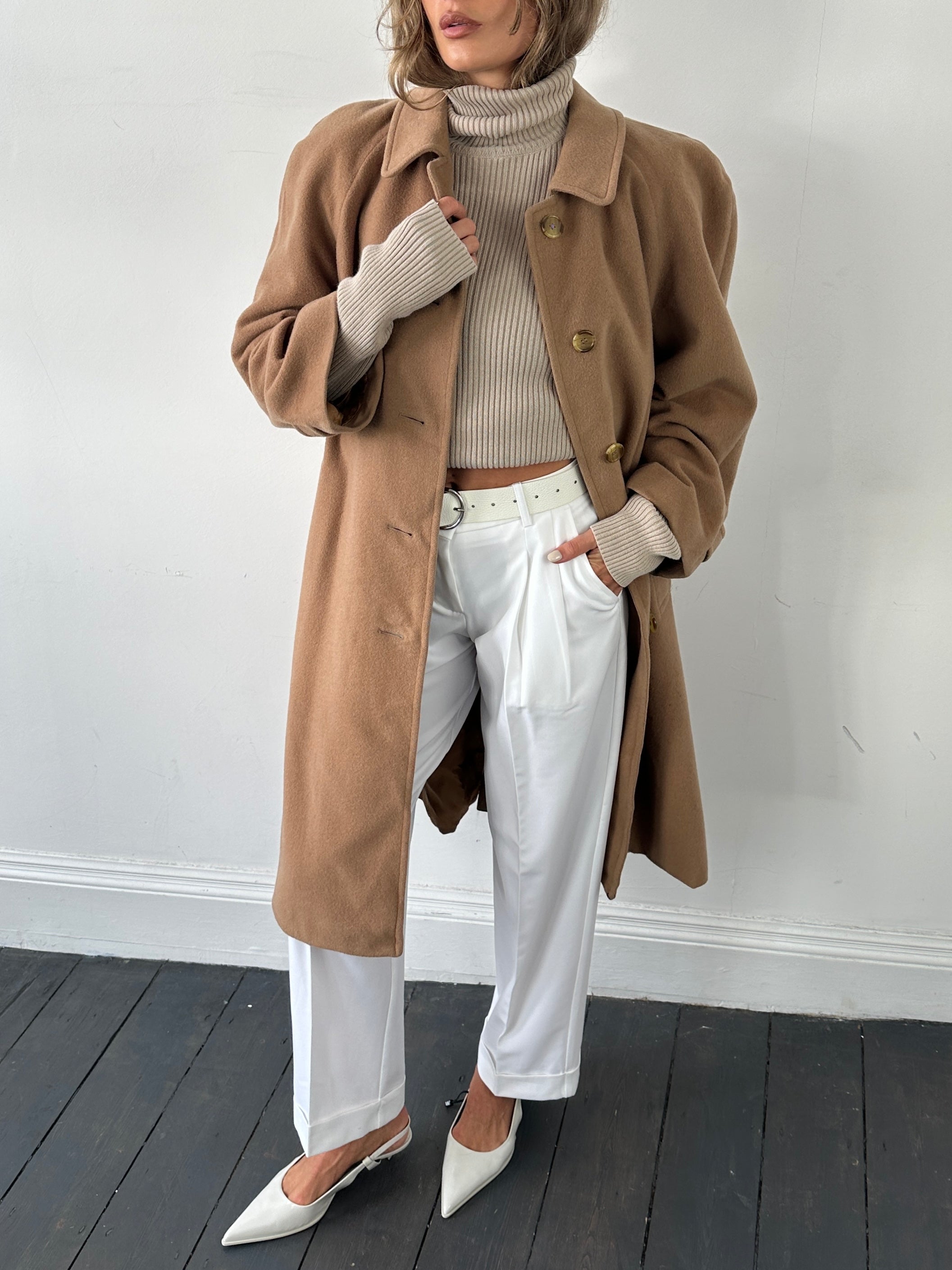 Burberry wool camel hair single-breasted coat in size L, featuring classic tailored design and button closure.