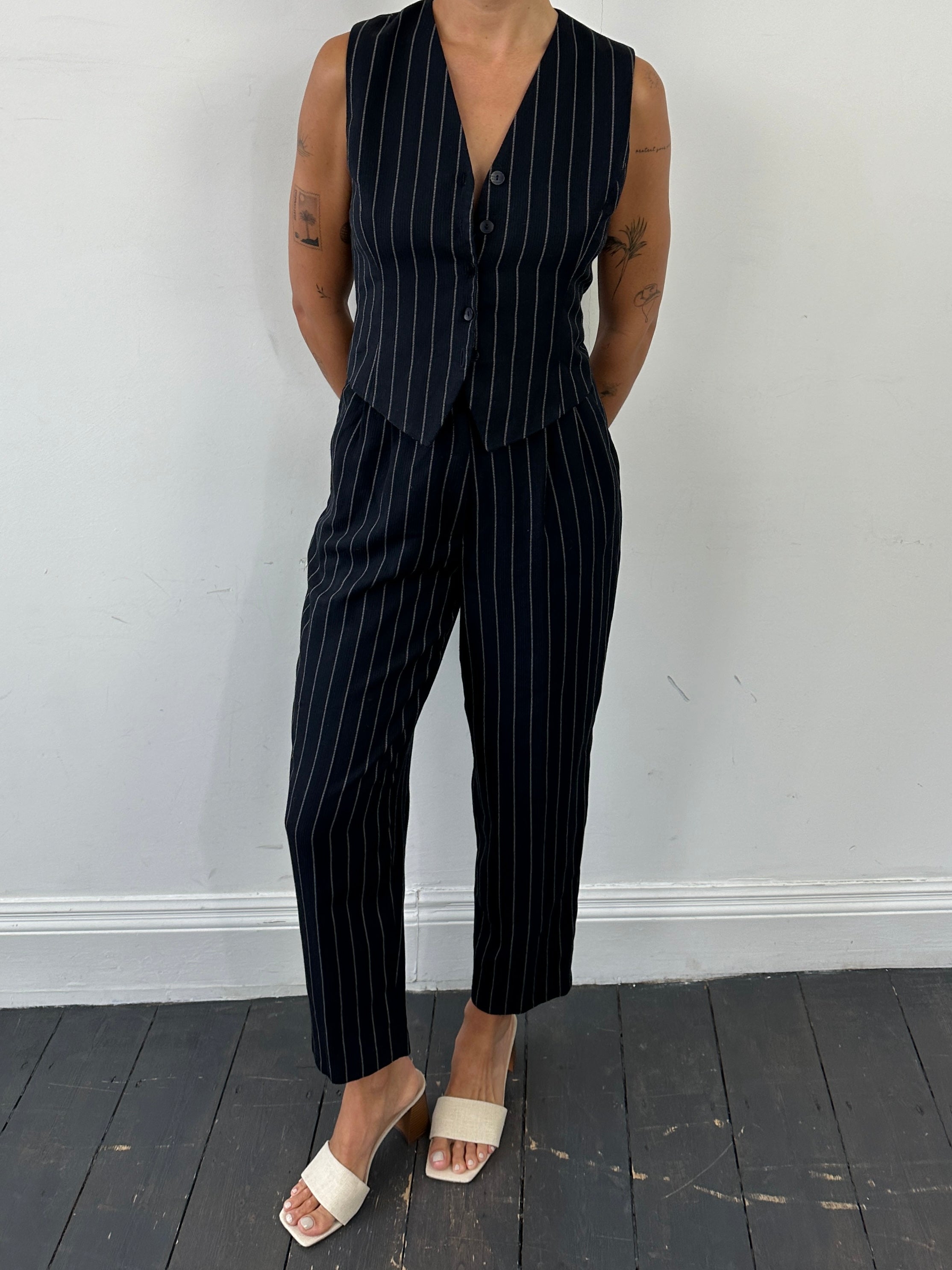 Vintage British vintage pinstripe two-piece waistcoat and trouser set, men's size M, classic tailored suit ensemble.
