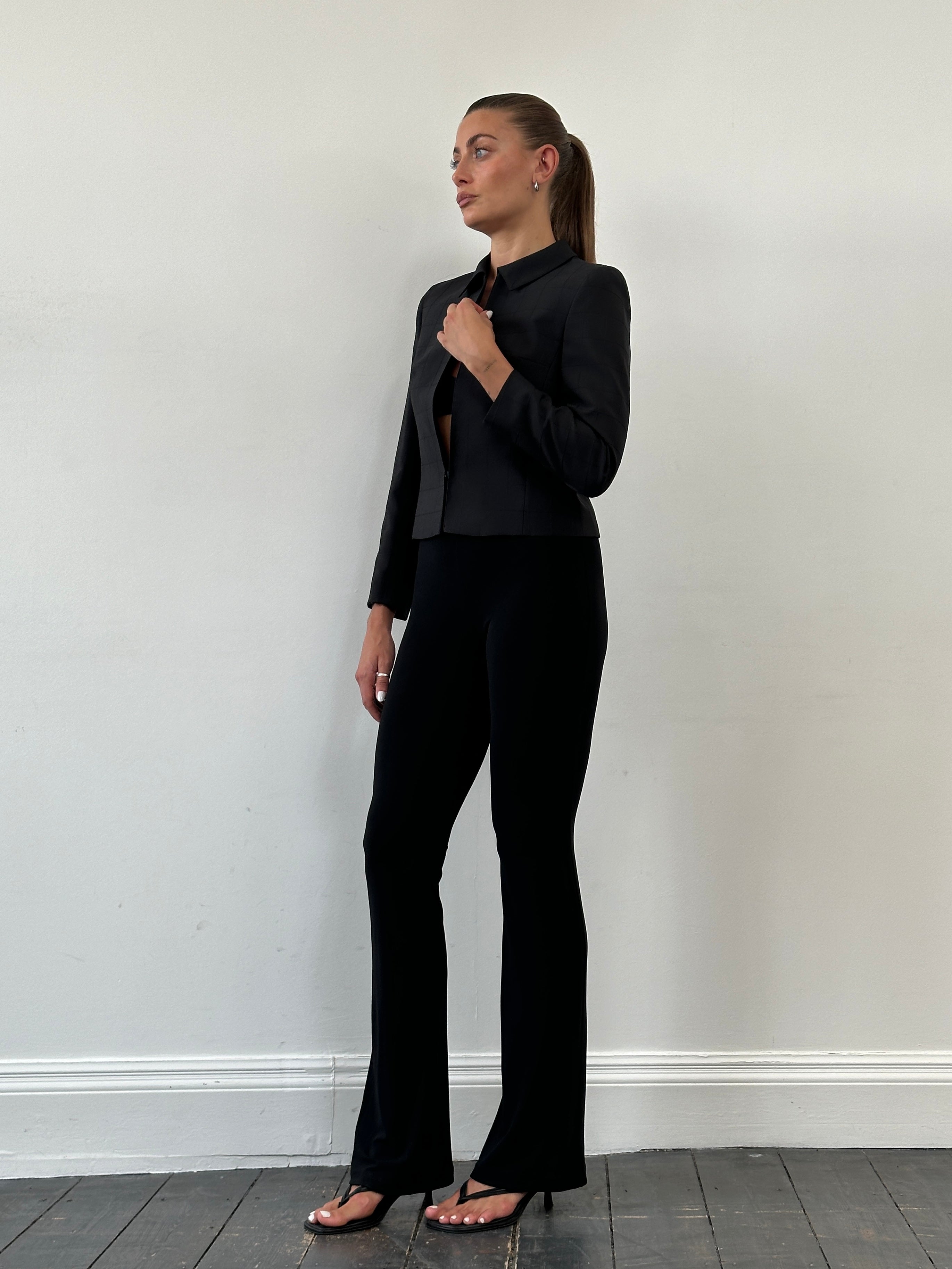 Vintage Italian vintage flared leggings, stylish trouser with a retro flare, displayed on a neutral background.