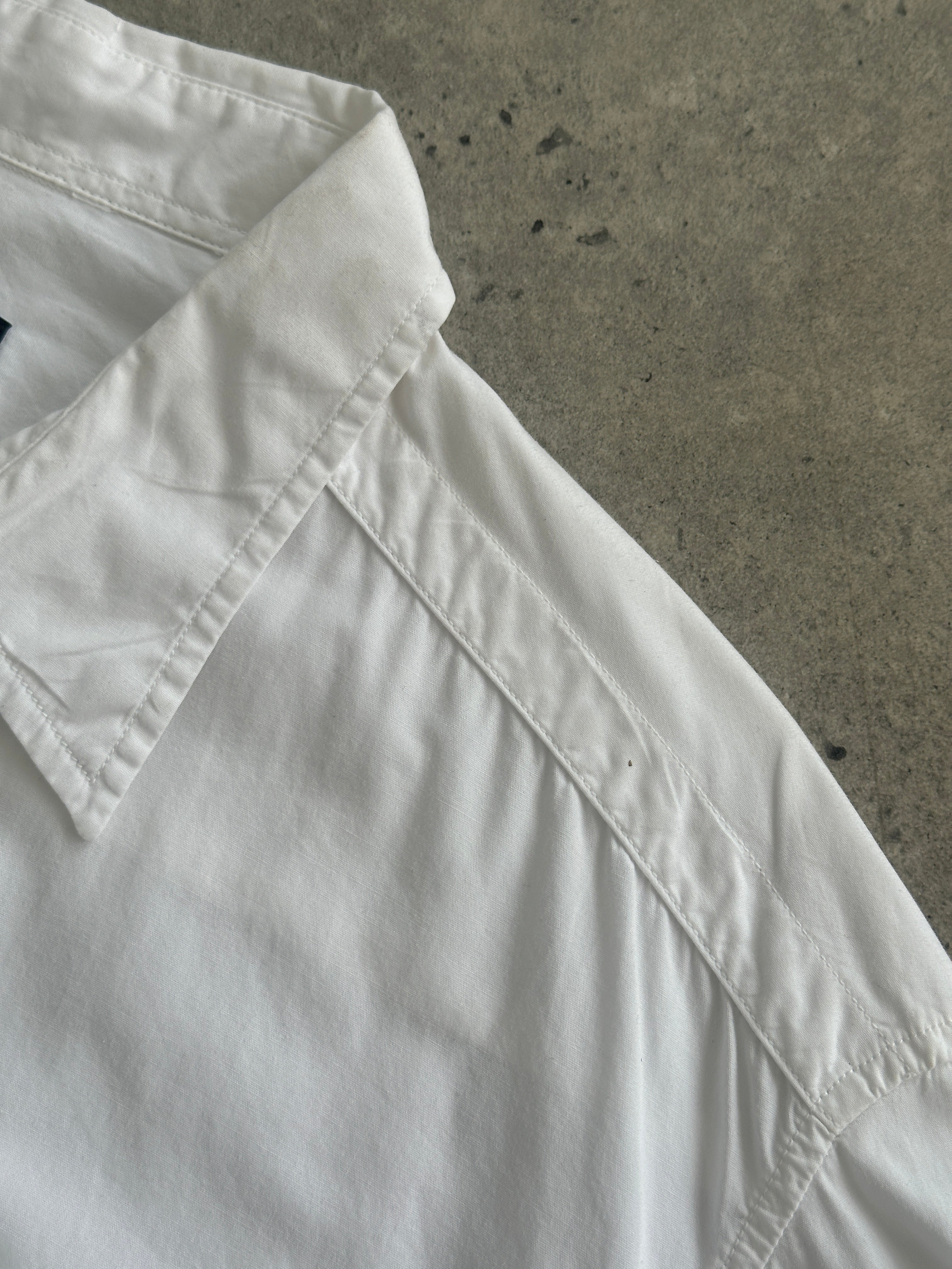 Versace Jeans Couture pure cotton shirt in size L/XL, with a classic design and stylish collar, displayed on a neutral background.