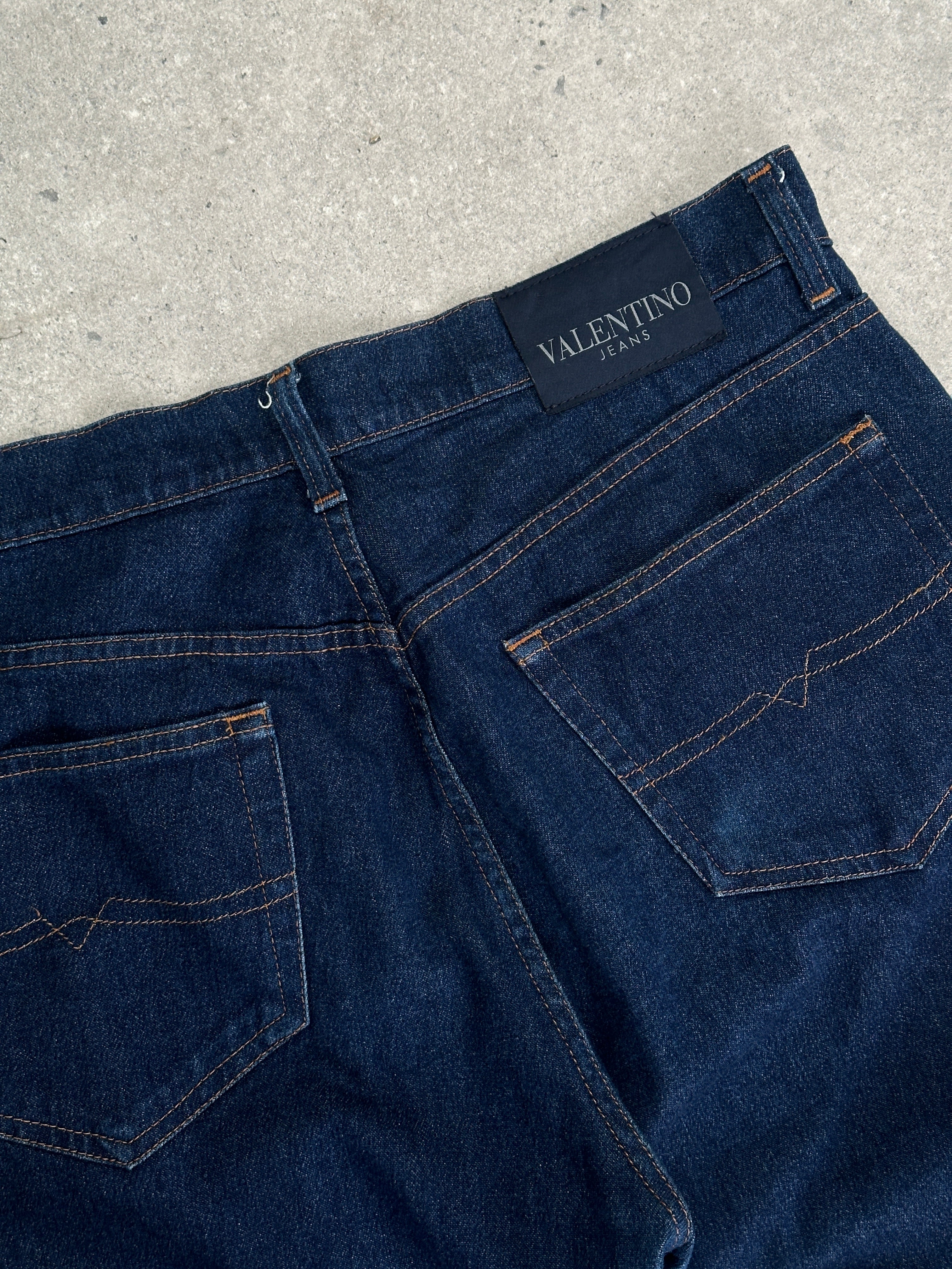 Valentino high waisted straight leg denim jeans in W34, showcasing classic blue denim with subtle stitching details.